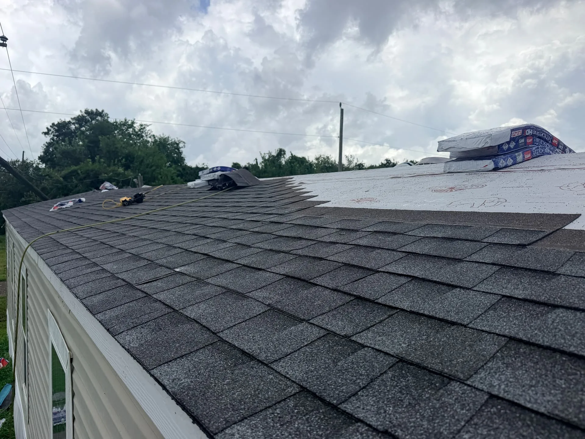 GAF Timberline HDZ architectural shingles being installed over synthetic underlayment in Braithwaite Louisiana