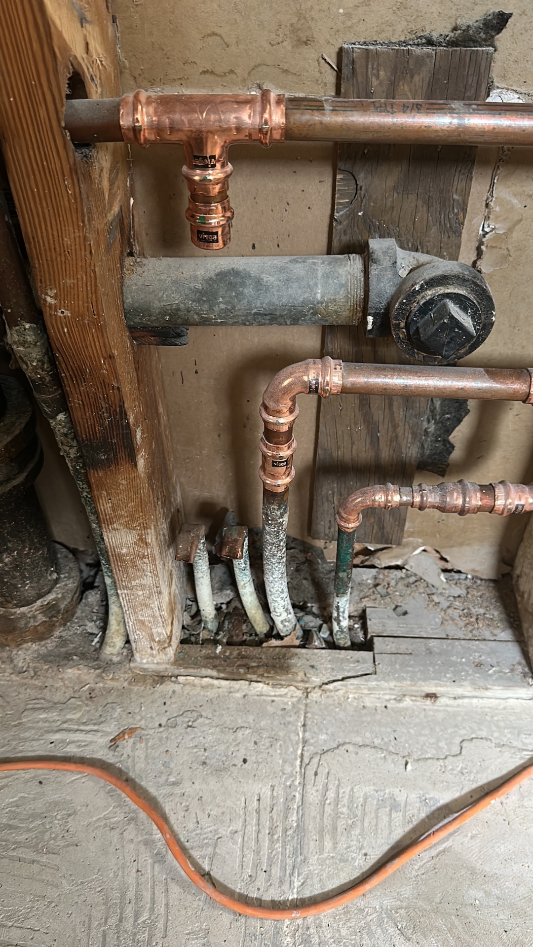 Detailed view of new Viega press-fit copper supply lines tied into the old galvanized stubs in Metairie master bath