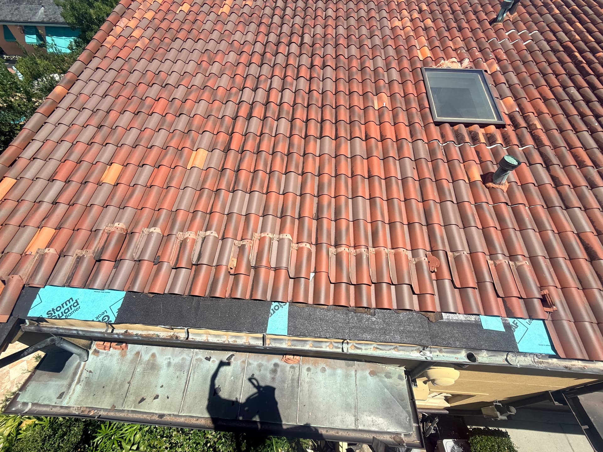 Storm Guard leak barrier and new underlayment installed along a terra cotta tile roof eave in Metairie Louisiana