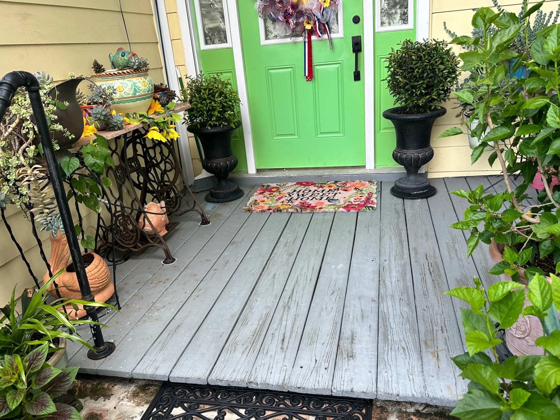 Before — worn painted wood porch decking at historic Algiers Point home