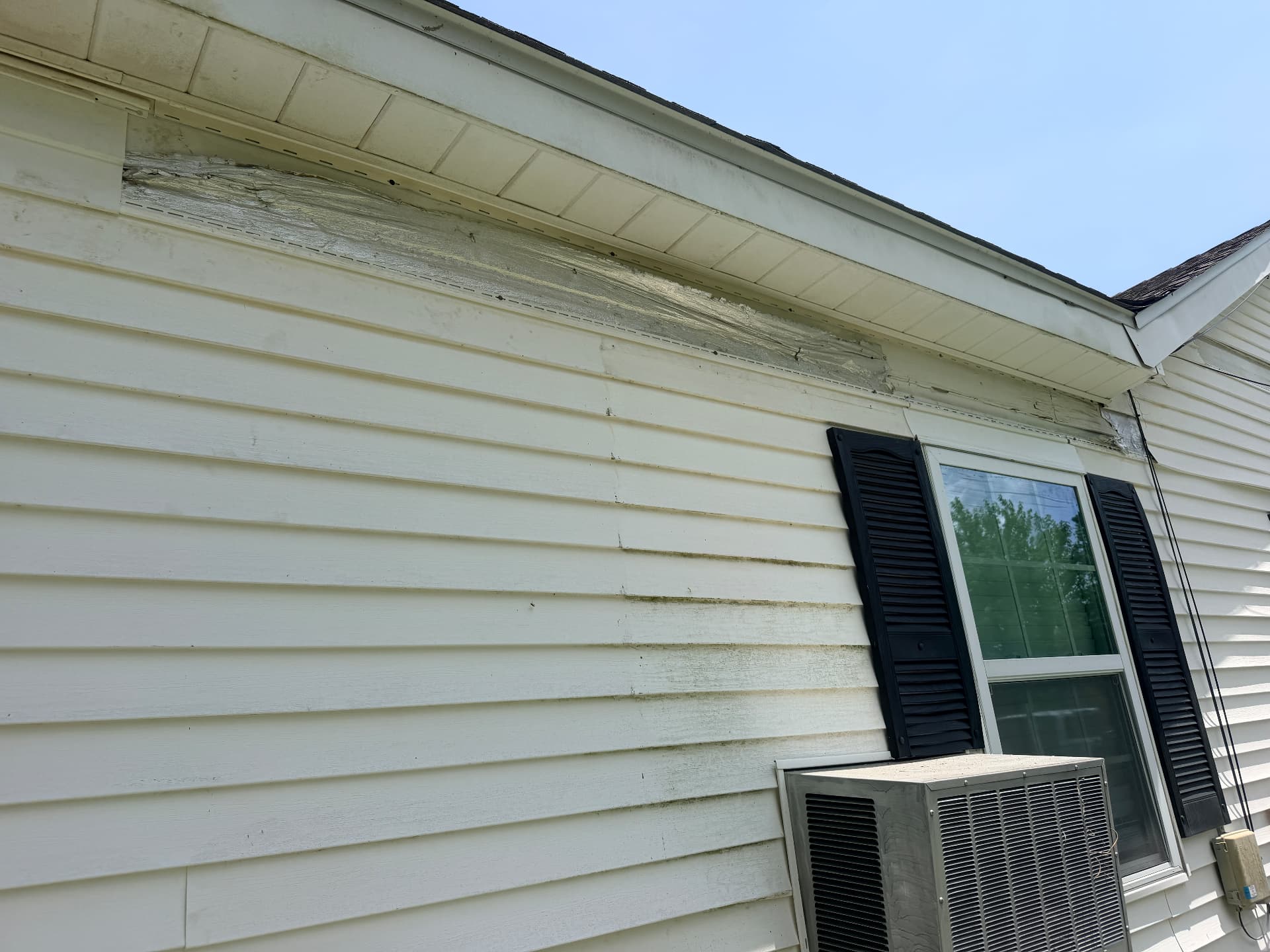 Side elevation with siding partially removed under the eaves in Metairie Louisiana