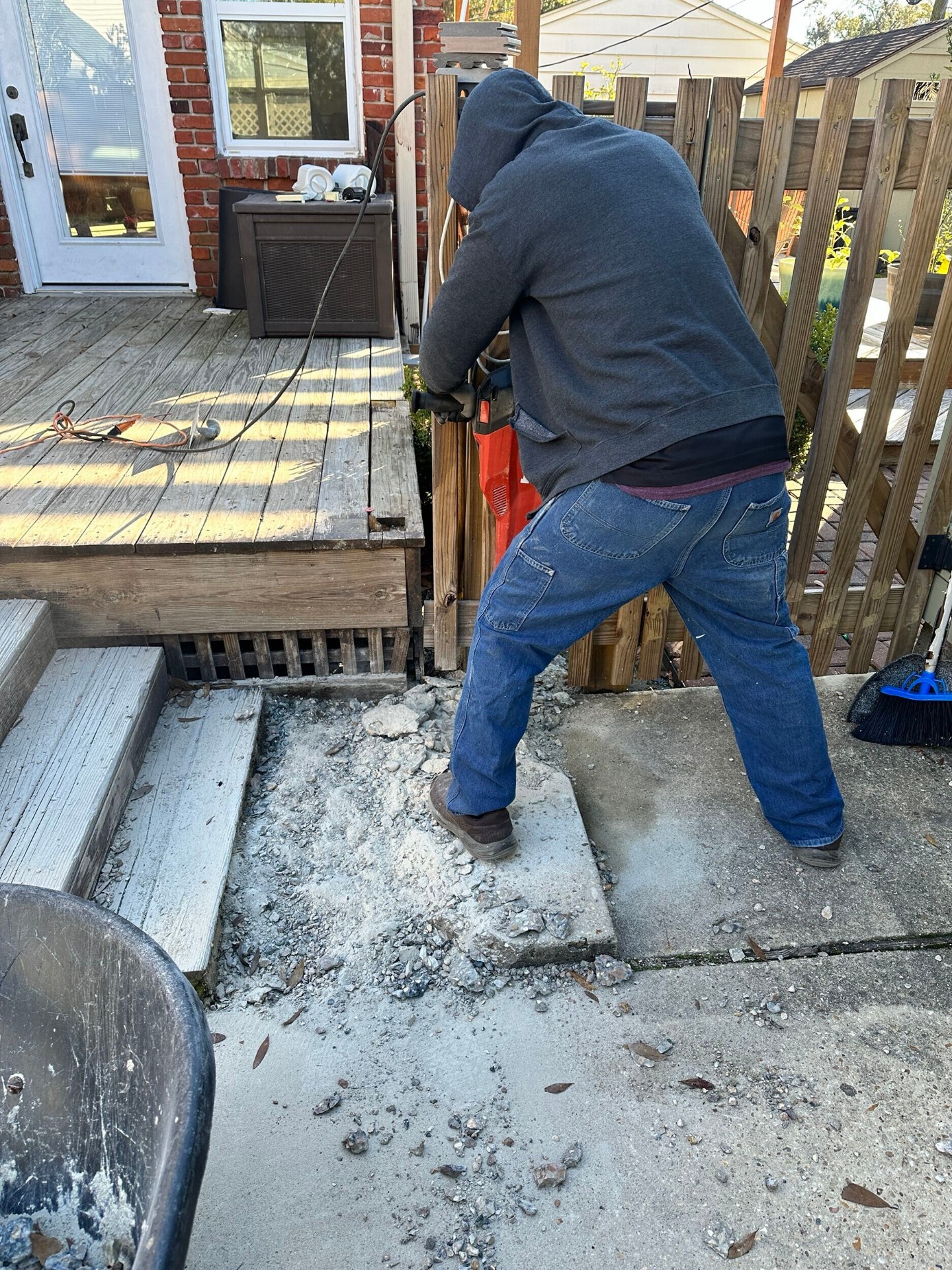 Demo of old concrete rear steps ahead of foundation reinforcement work at Blanke Street Metairie home