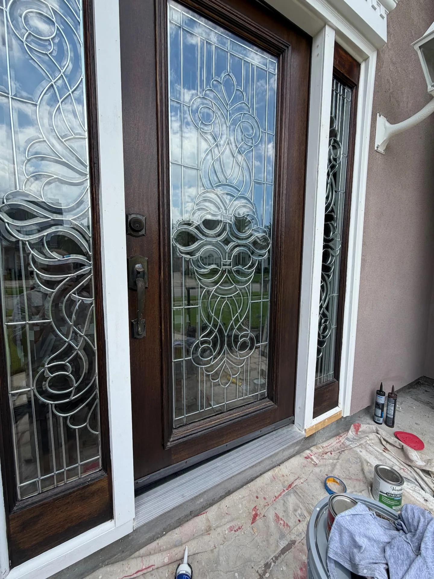 Refinished mahogany door and sidelights sealed with spar urethane in Destrehan