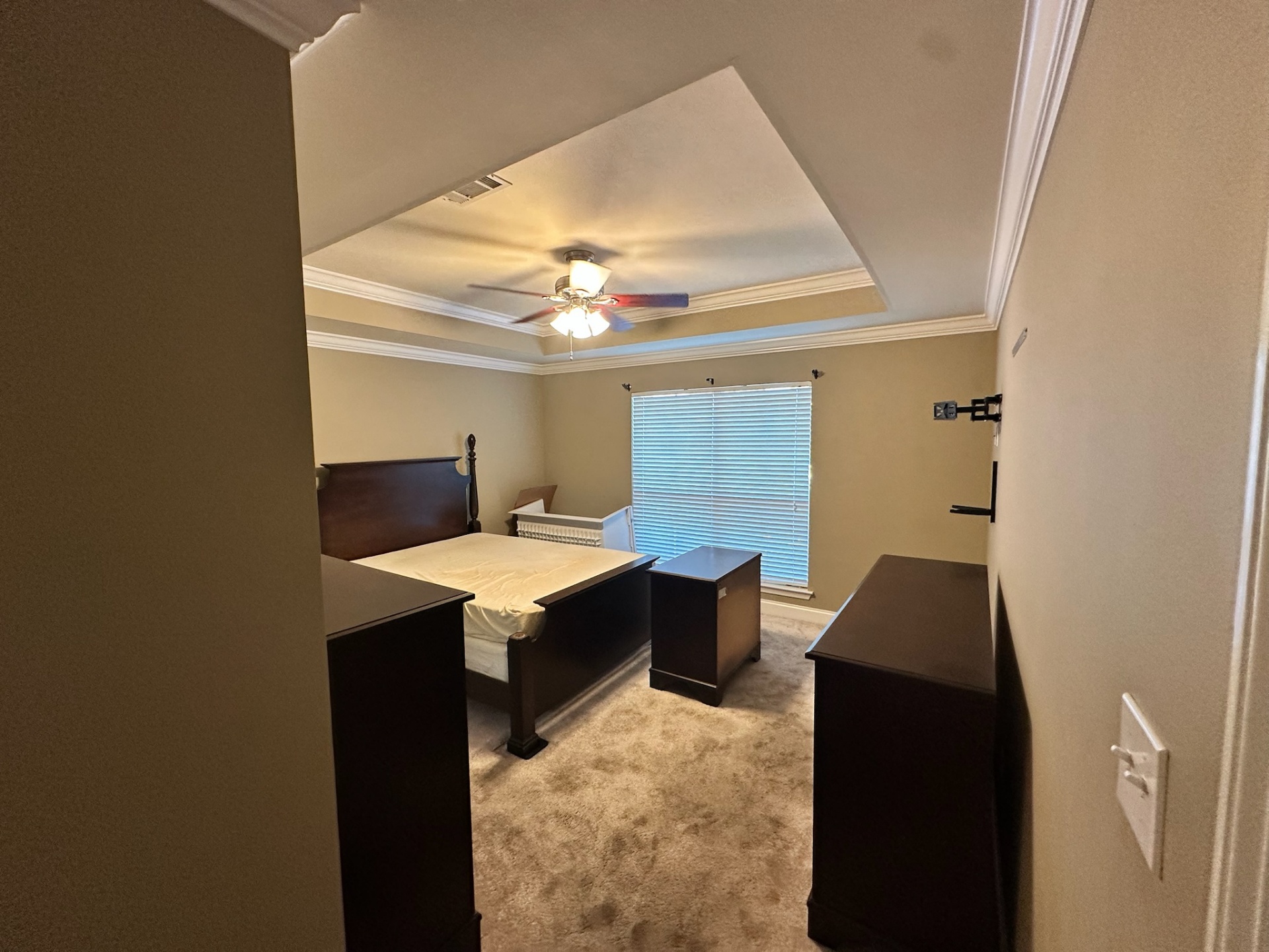 Before — master bedroom carpet under tray ceiling in Gonzales