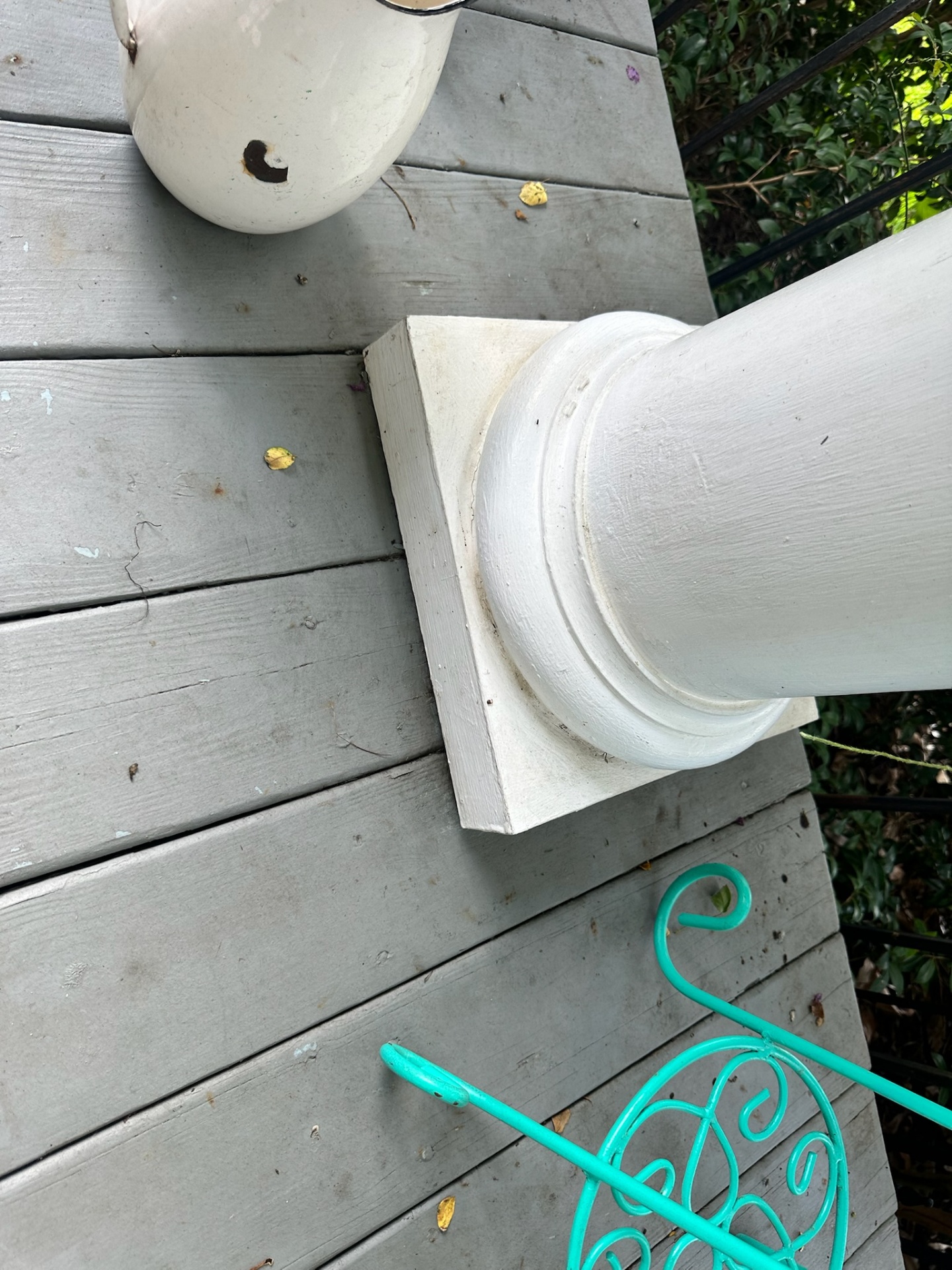 Before — worn decking around historic column base at Algiers Point porch