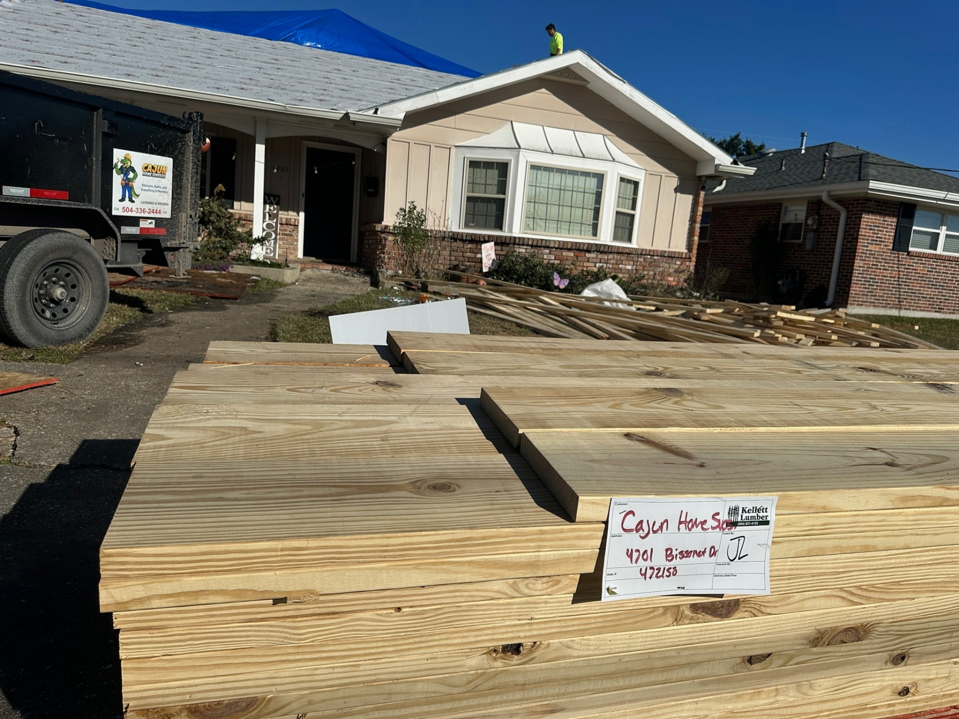 Kellett Lumber delivery on Bissonet Drive in Metairie staging framing material for second-floor addition
