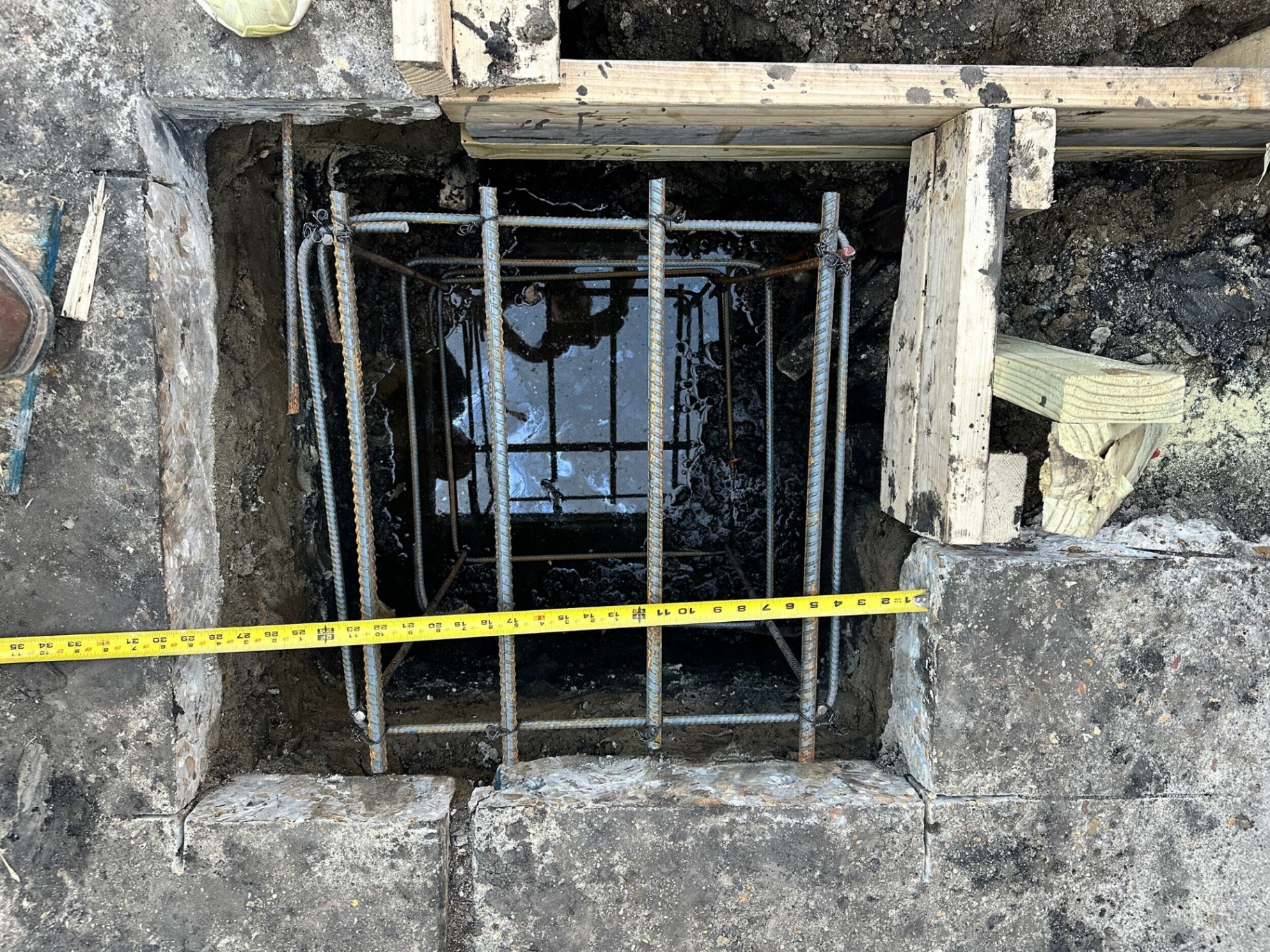 Top-down view of new footing form with tied rebar cage during Blanke Street Metairie foundation reinforcement
