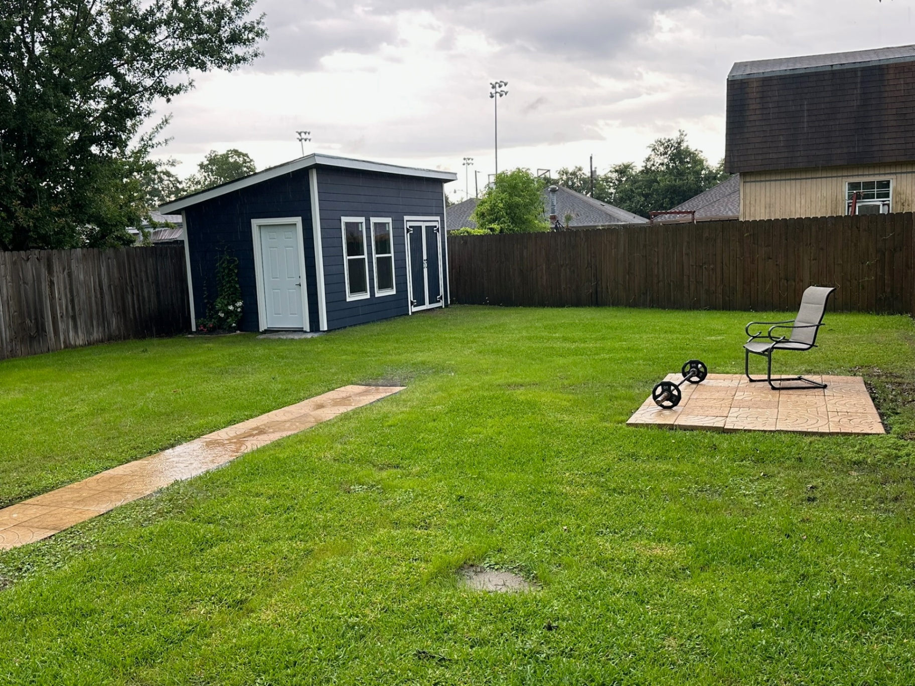 Custom Hardie shed finished in Metairie backyard Louisiana