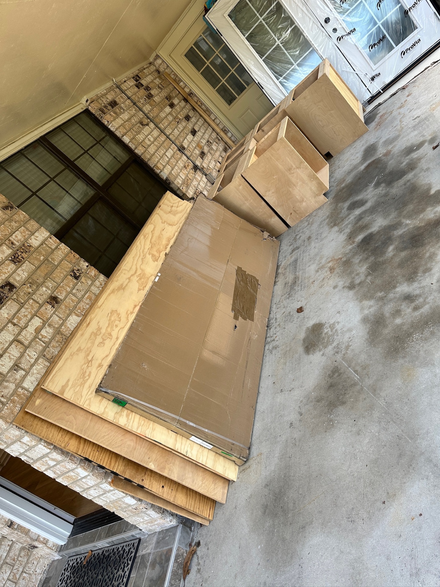 Custom-built maple vanity cabinets and drawer boxes delivered on the front porch of the Metairie master bath project
