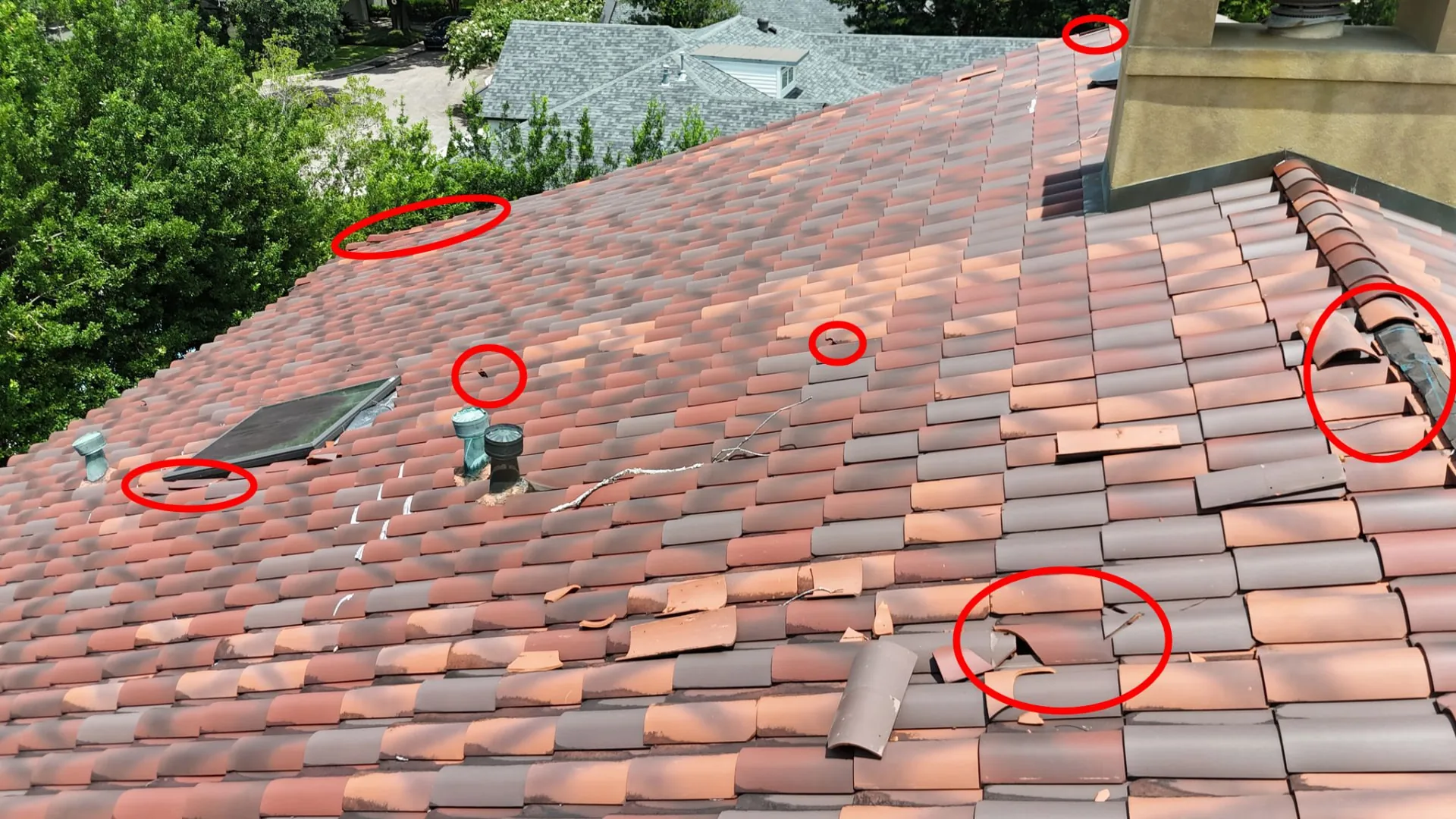 Aerial inspection markup showing displaced terra cotta tiles along the ridge and field of a Metairie Louisiana tile roof