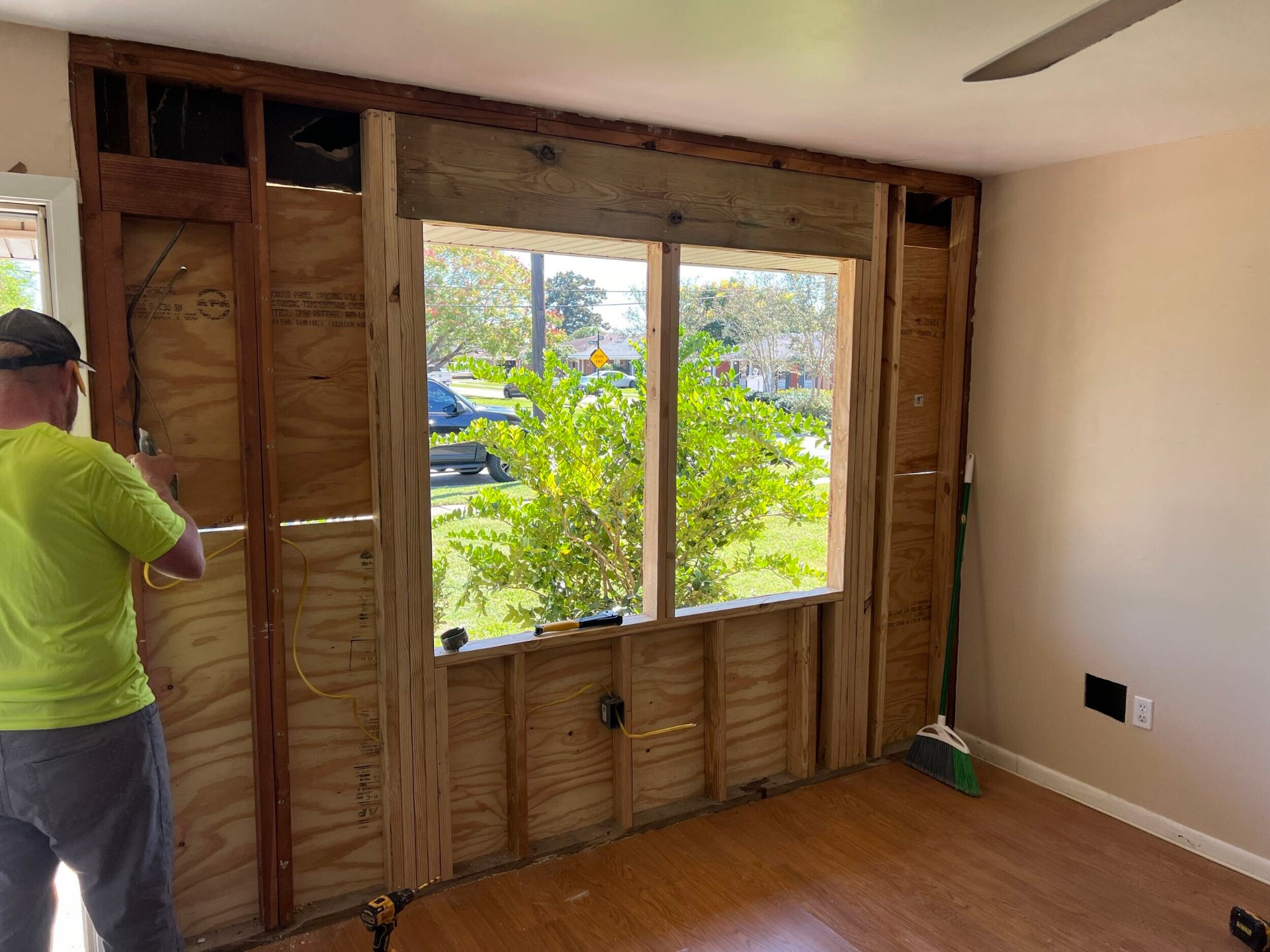 Interior view of the new window rough-in showing fresh framing, header, and cripples on the rebuilt Gretna exterior wall