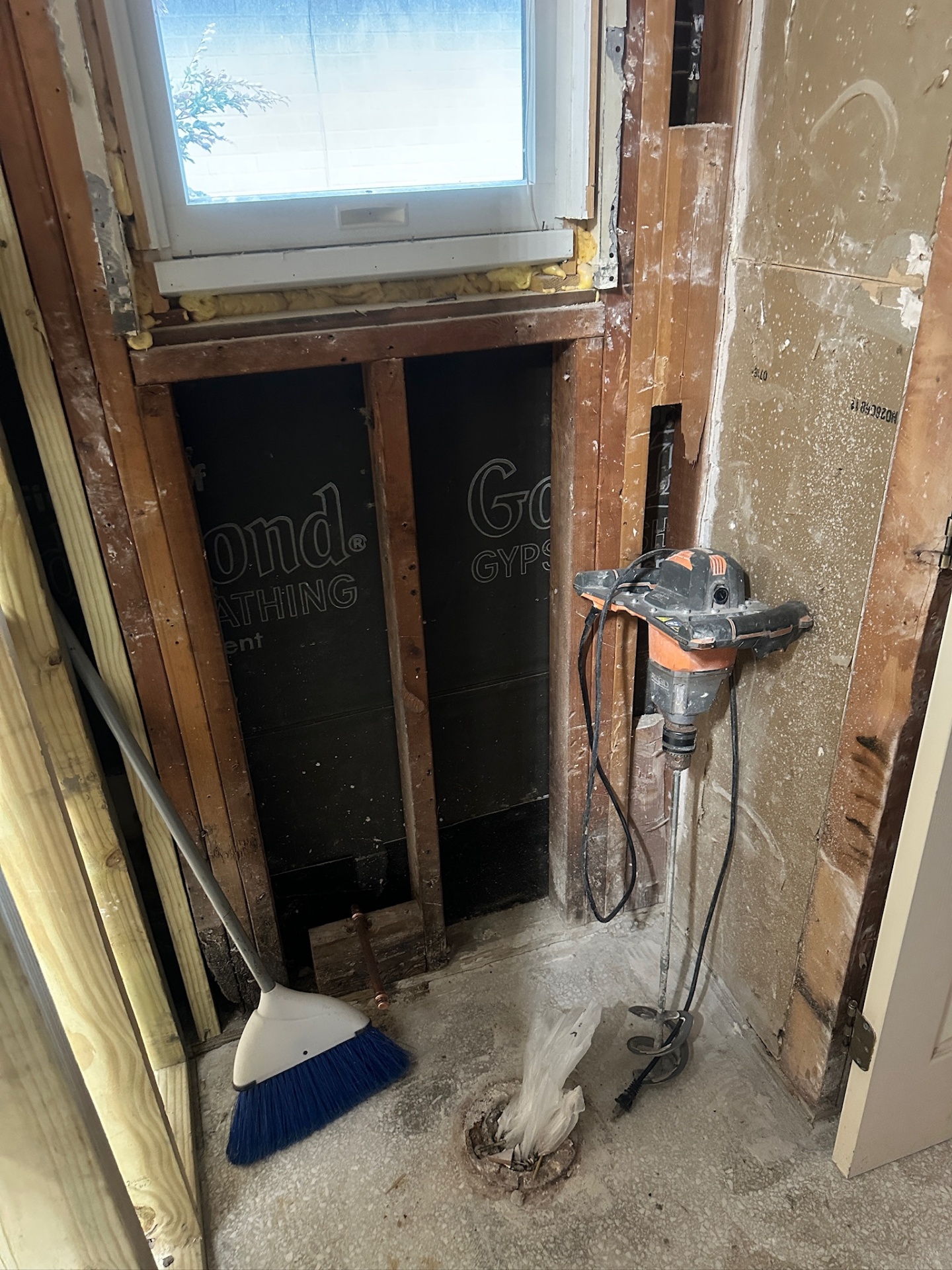 New pressure-treated framing around window with copper supply lines rerouted for walk-in shower in Metairie master bath