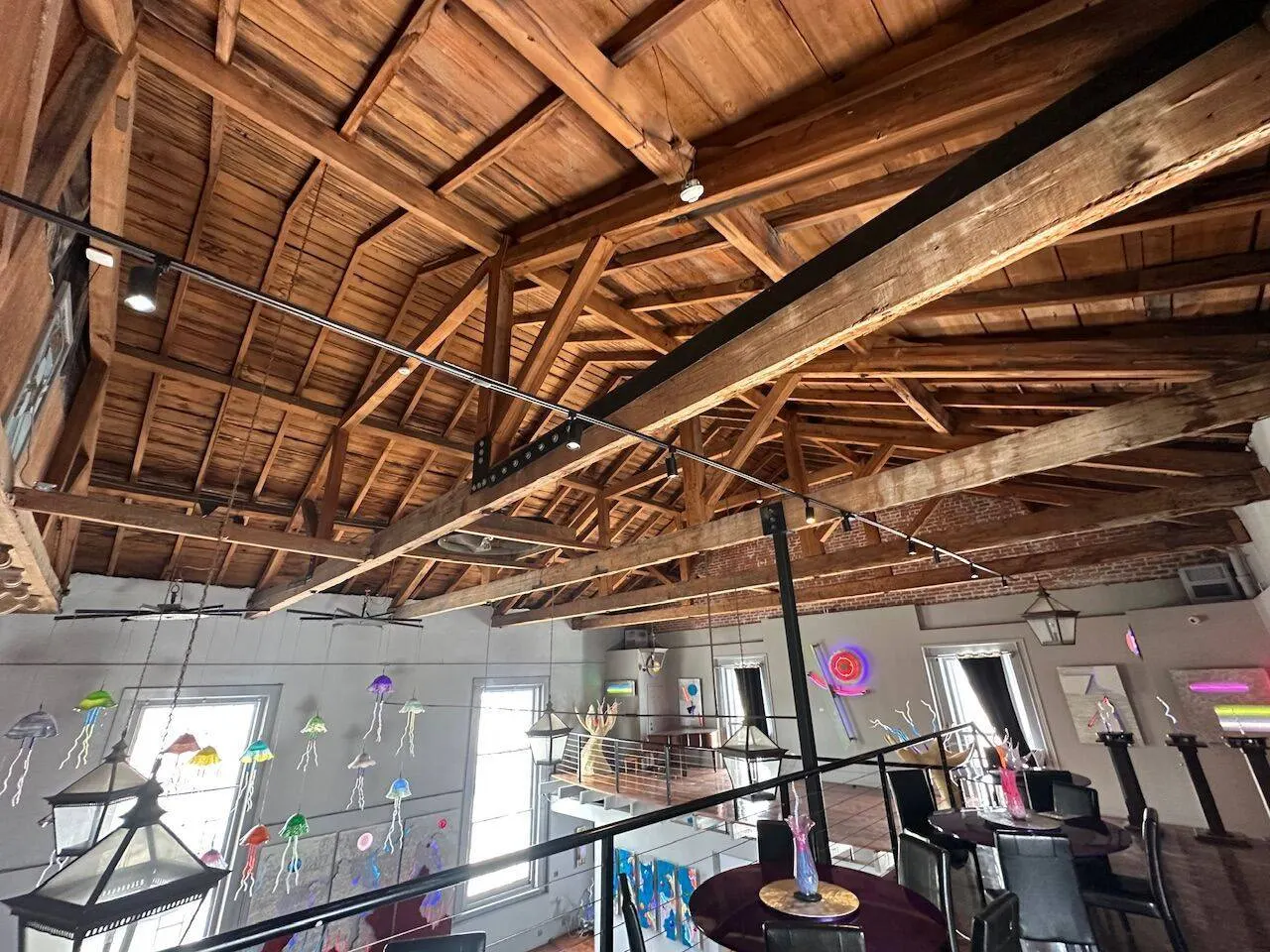 Deteriorating timber roof trusses requiring structural repair at commercial art gallery in New Orleans
