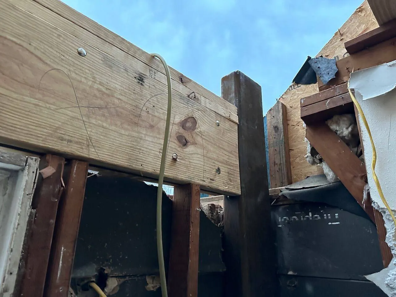 Structural header beam connection detail during home reconstruction