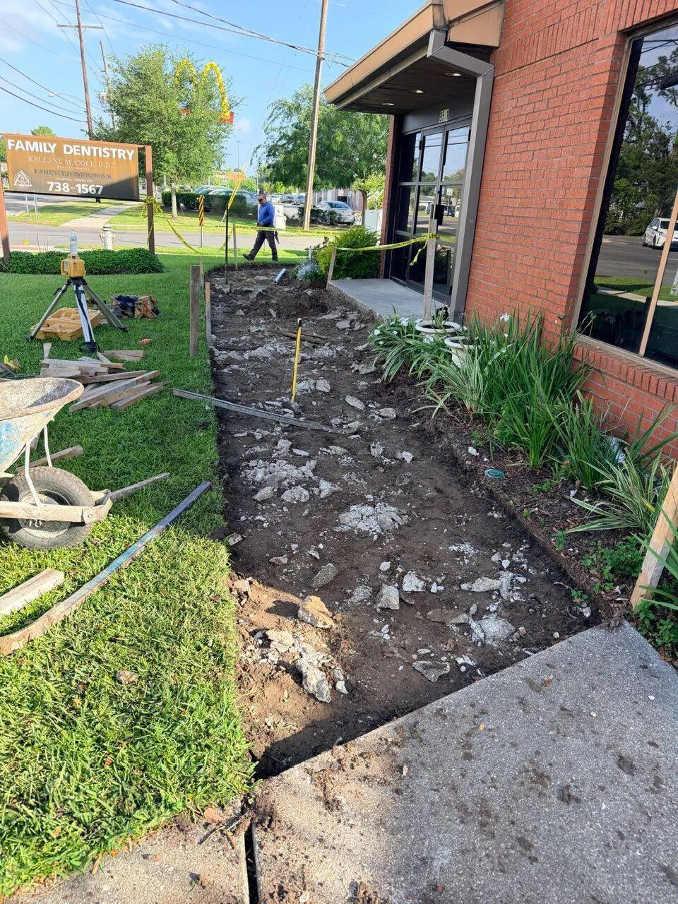 Cajun Home Services concrete sidewalk demolition in progress at Family Dentistry office in River Ridge Louisiana Jefferson Parish