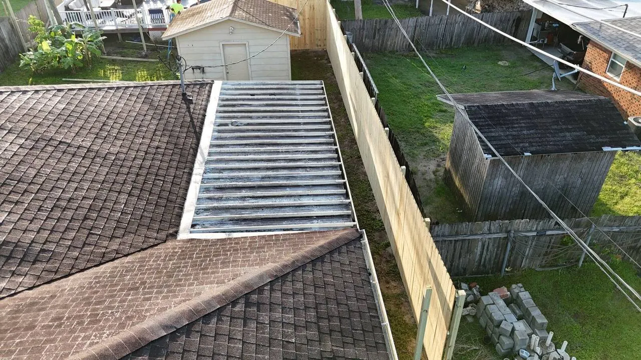 Aerial view of corrugated patio cover and new fence installation in Kenner Louisiana