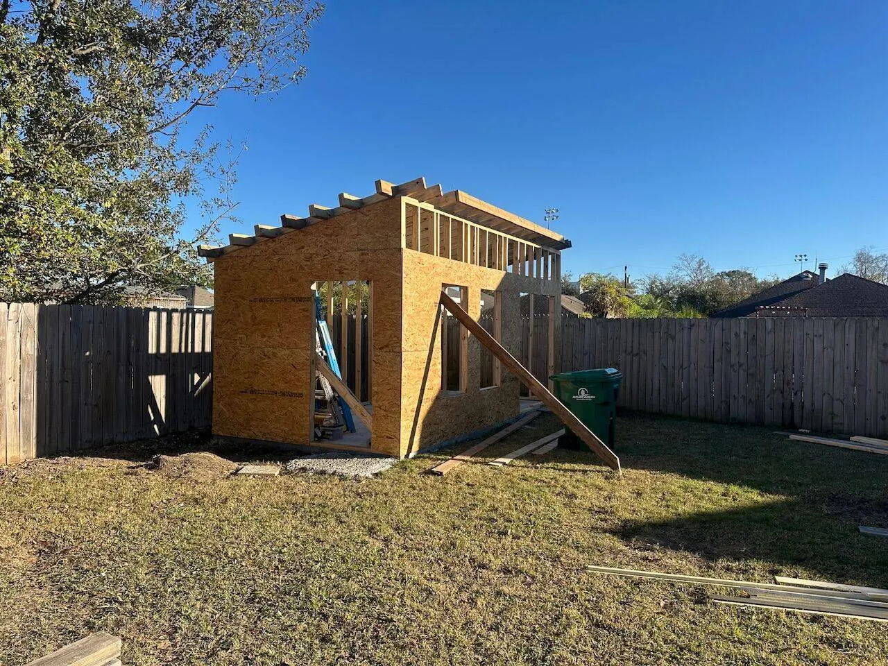 OSB sheathing and rafter framing in progress on new construction shed in Meraux LA