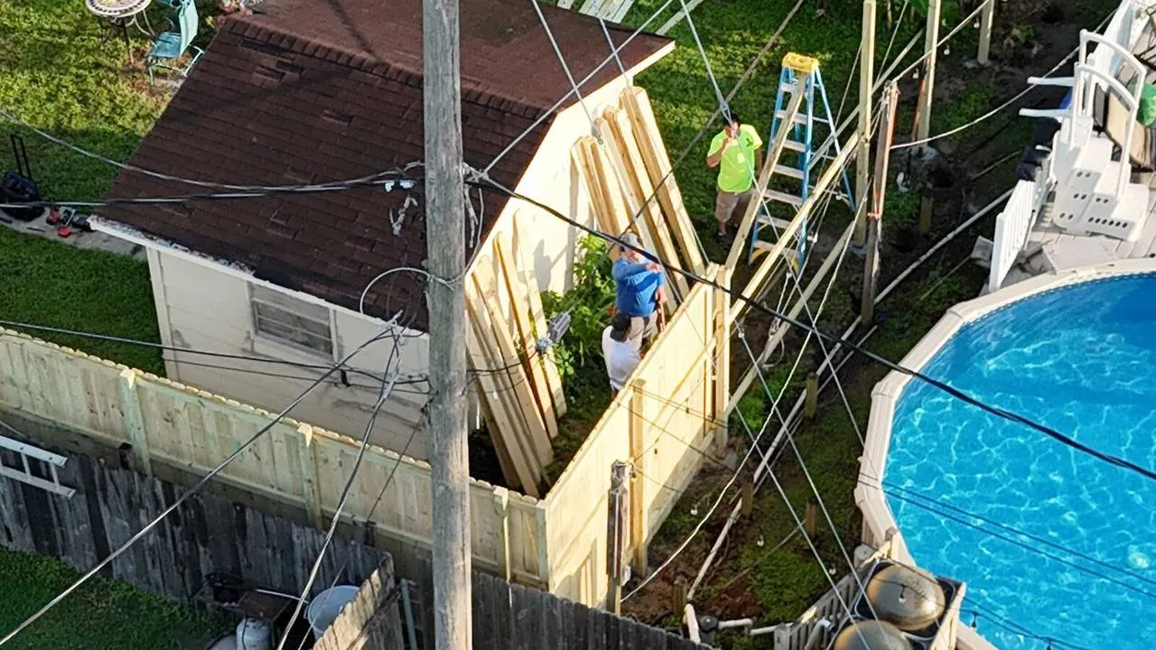 Home addition framing in progress in Metairie backyard
