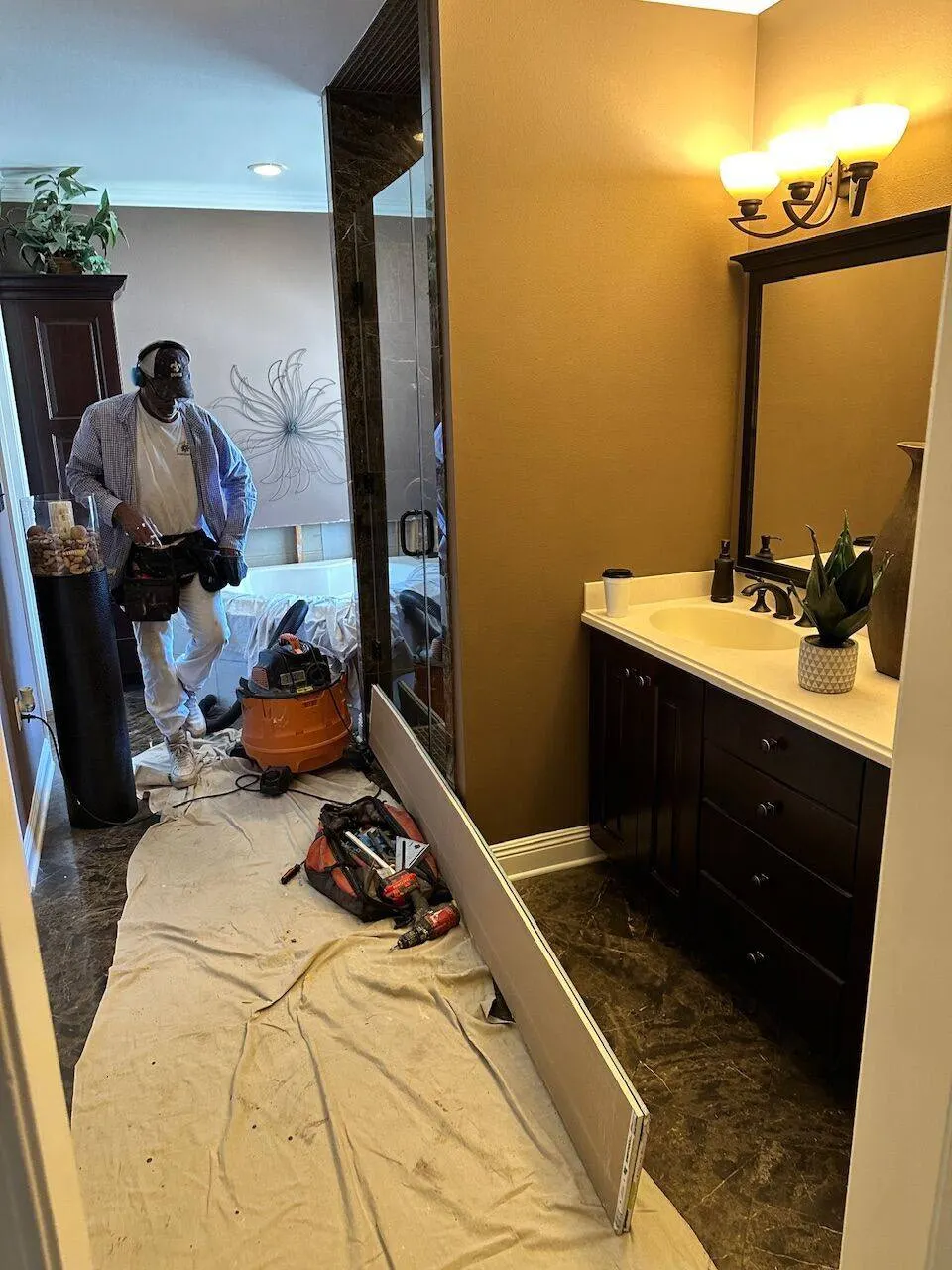 Cajun Home Services crew working on bathroom vanity installation in Jefferson Parish