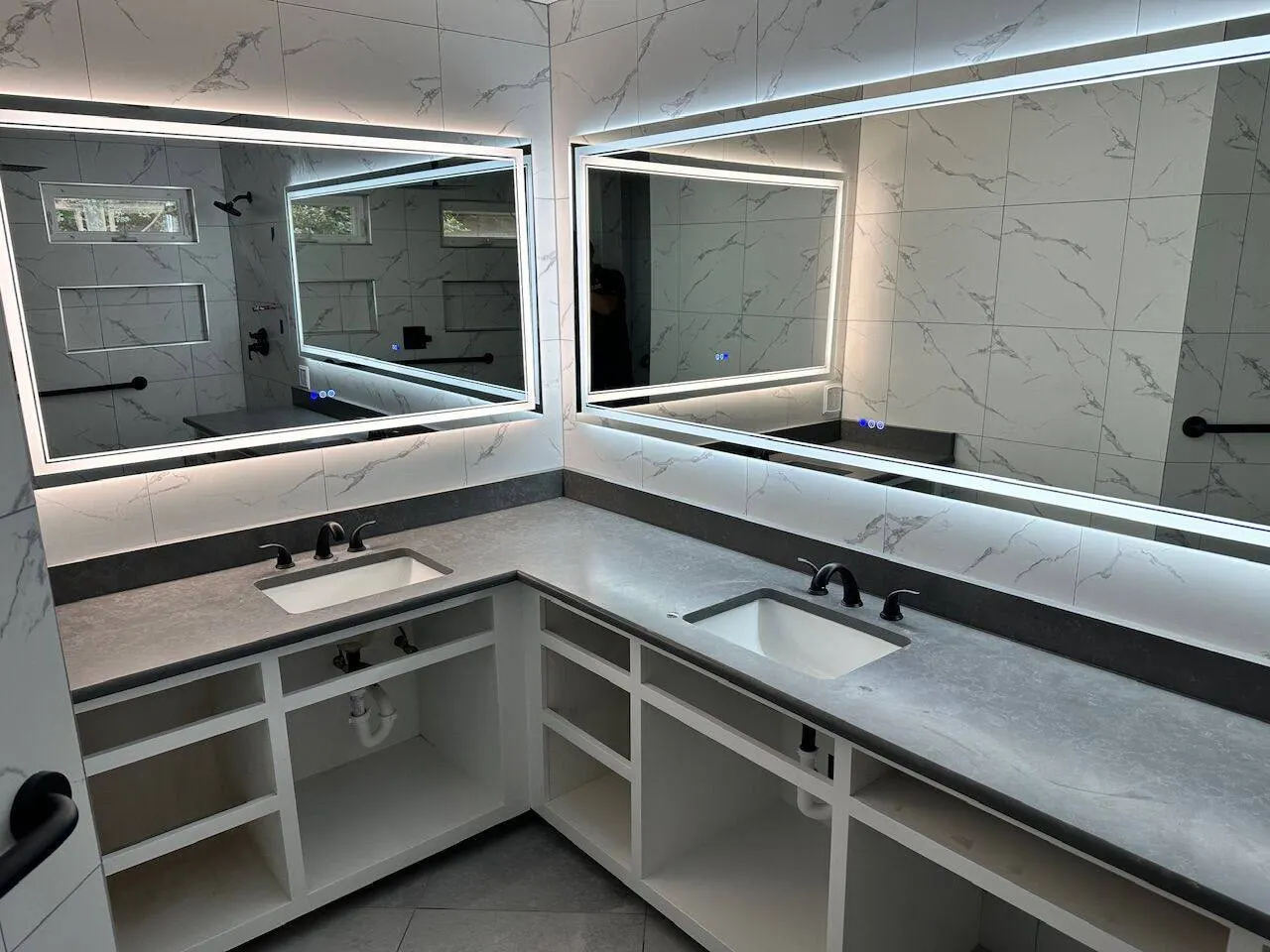 Finished master bath LED mirrors with marble backdrop Metairie Louisiana