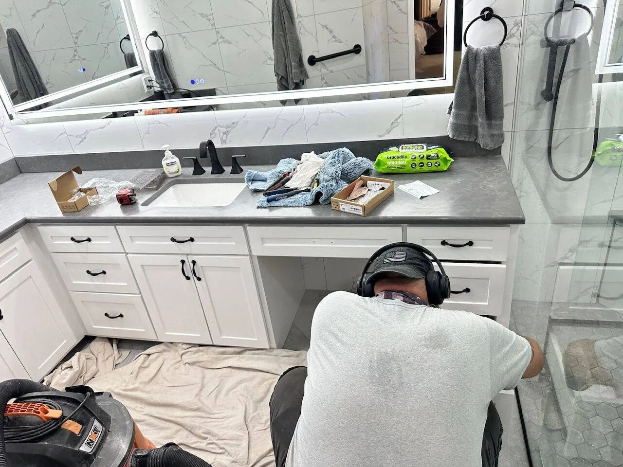 Cajun Home Services crew installing bathroom vanity plumbing in Jefferson Parish