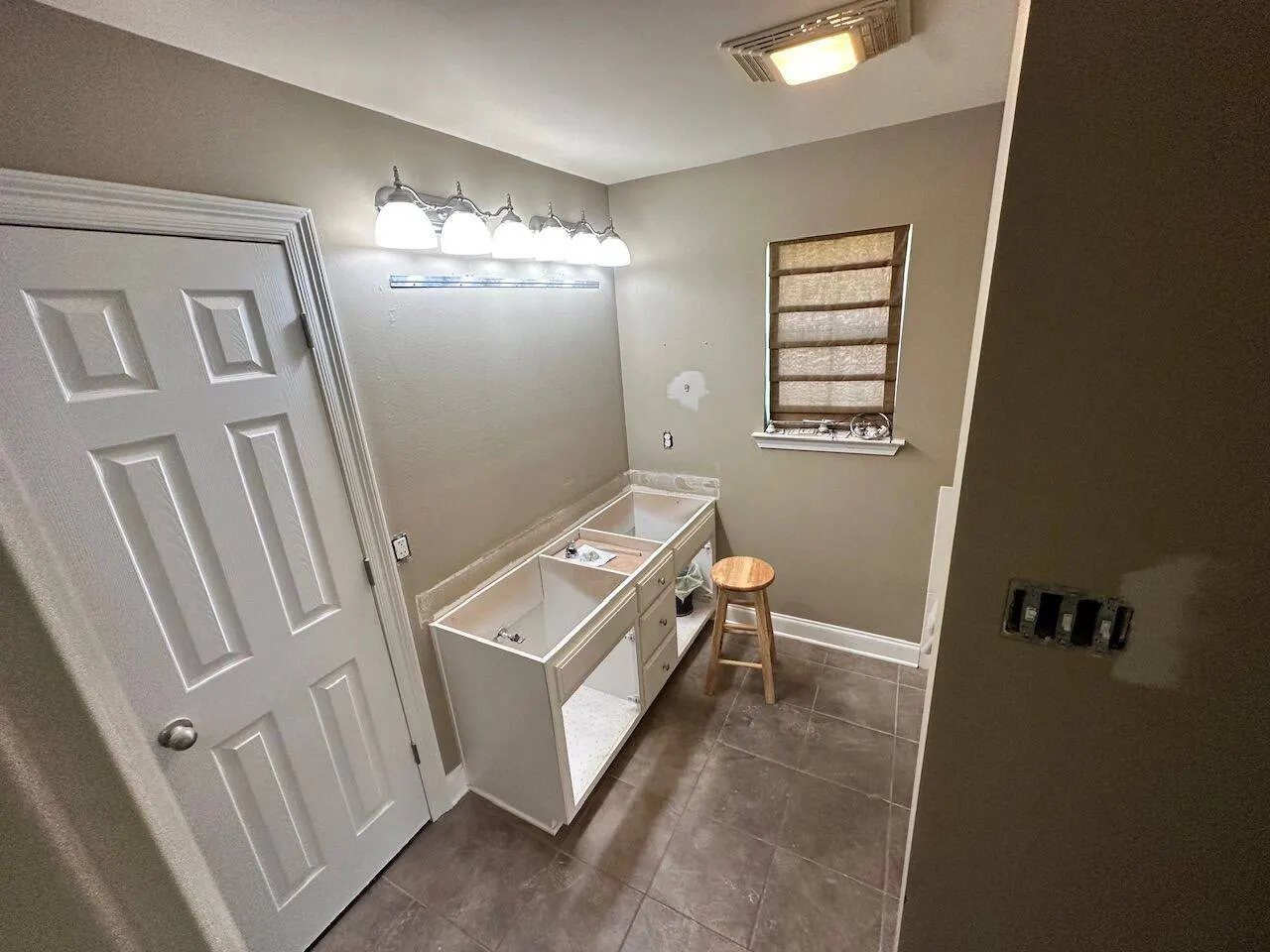 Bathroom vanity installation awaiting countertop in Gonzales