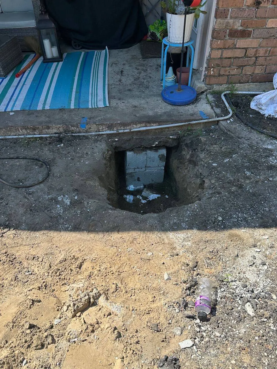 Completed concrete block pier support installed under residential foundation in Metairie