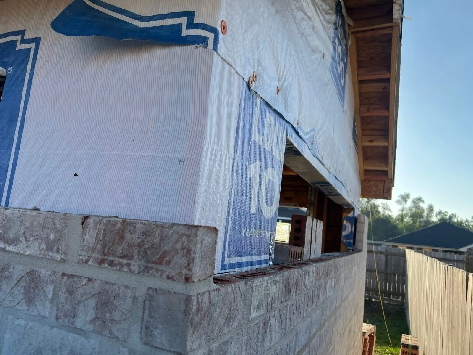 Brick corner coursing detail with mortar joints on custom Cajun Home Services shed in Meraux
