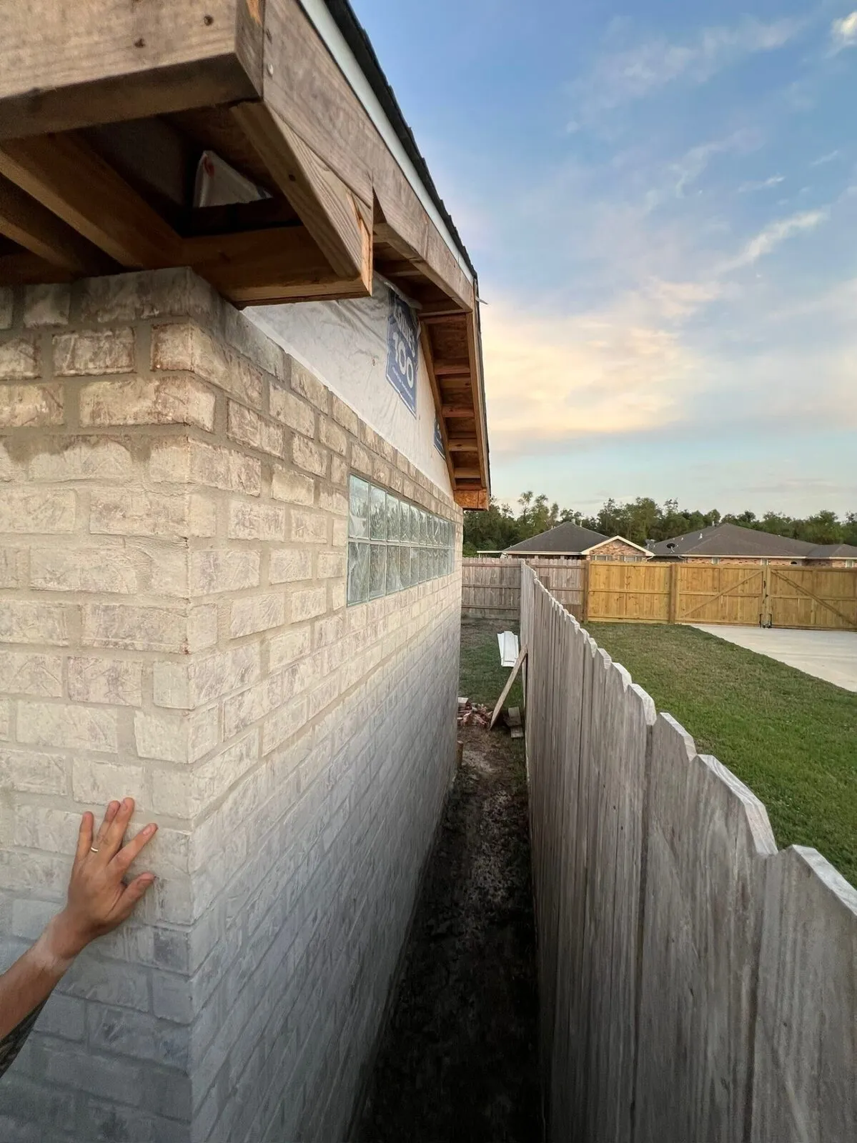 Side elevation of brick veneer masonry shed showing tight mortar joints in Meraux Louisiana