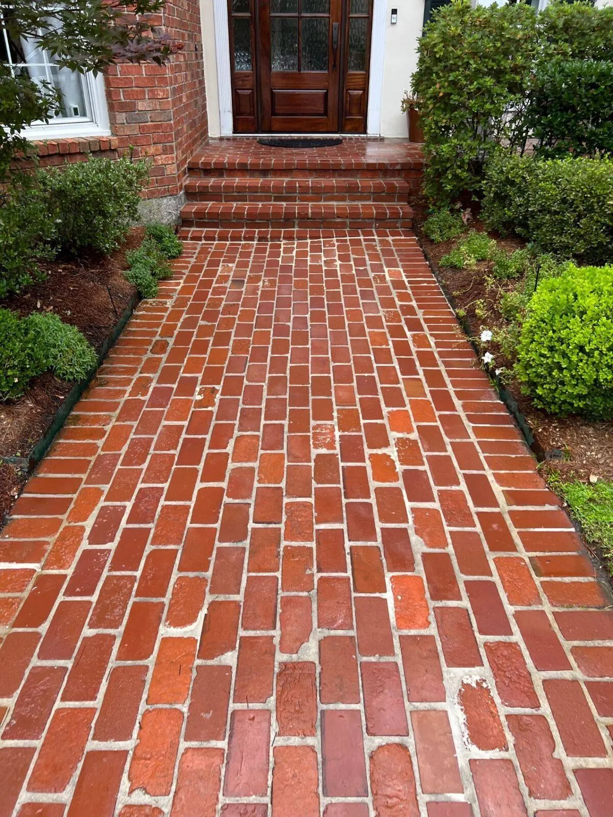 Brick walkway and front entry restoration with herringbone pattern in Kenner LA