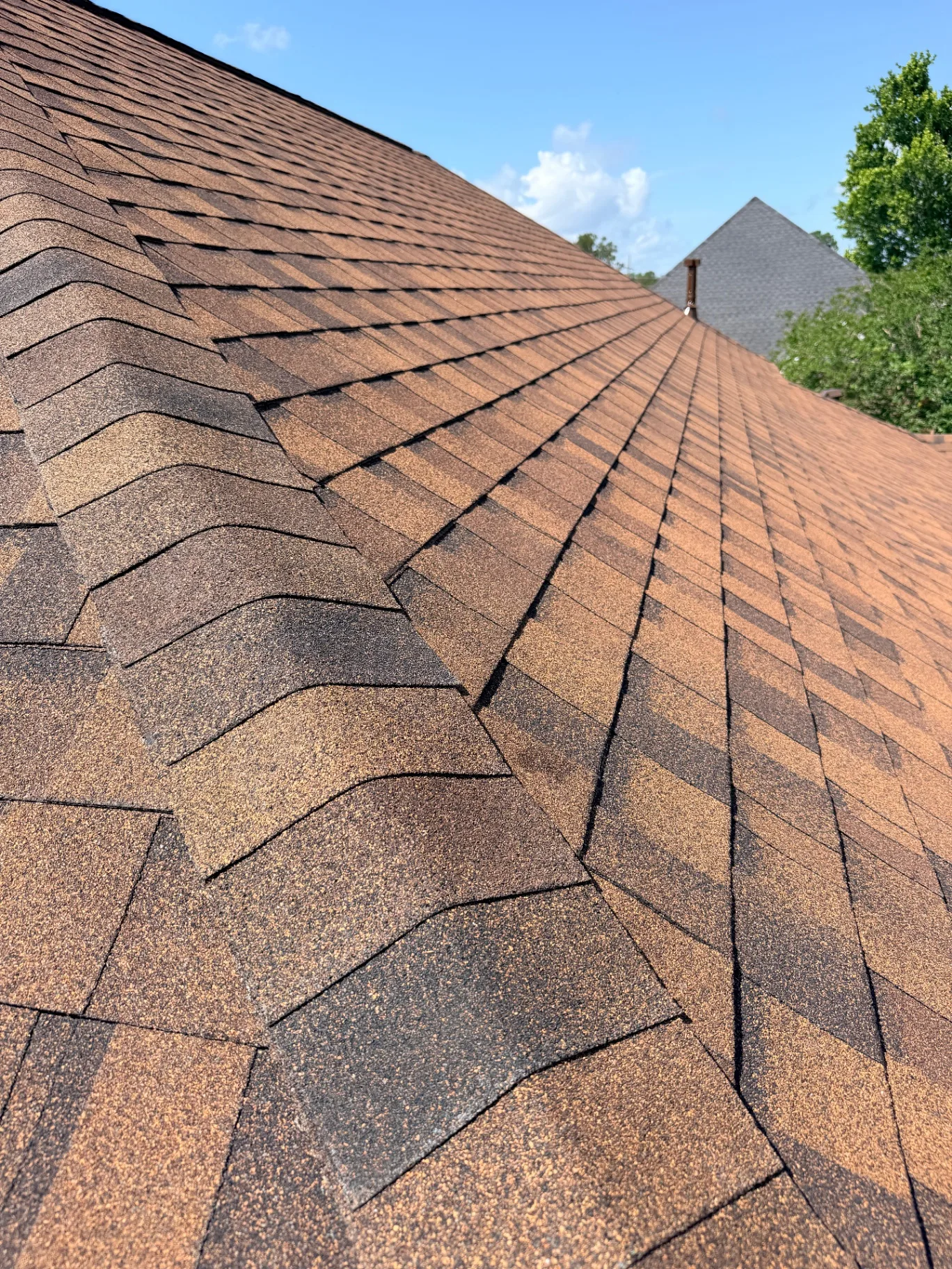 Close-up zoom of newly installed Atlas Pinnacle Pristine architectural shingles on the Destrehan Louisiana home after re-roof replacement by Cajun Home Services