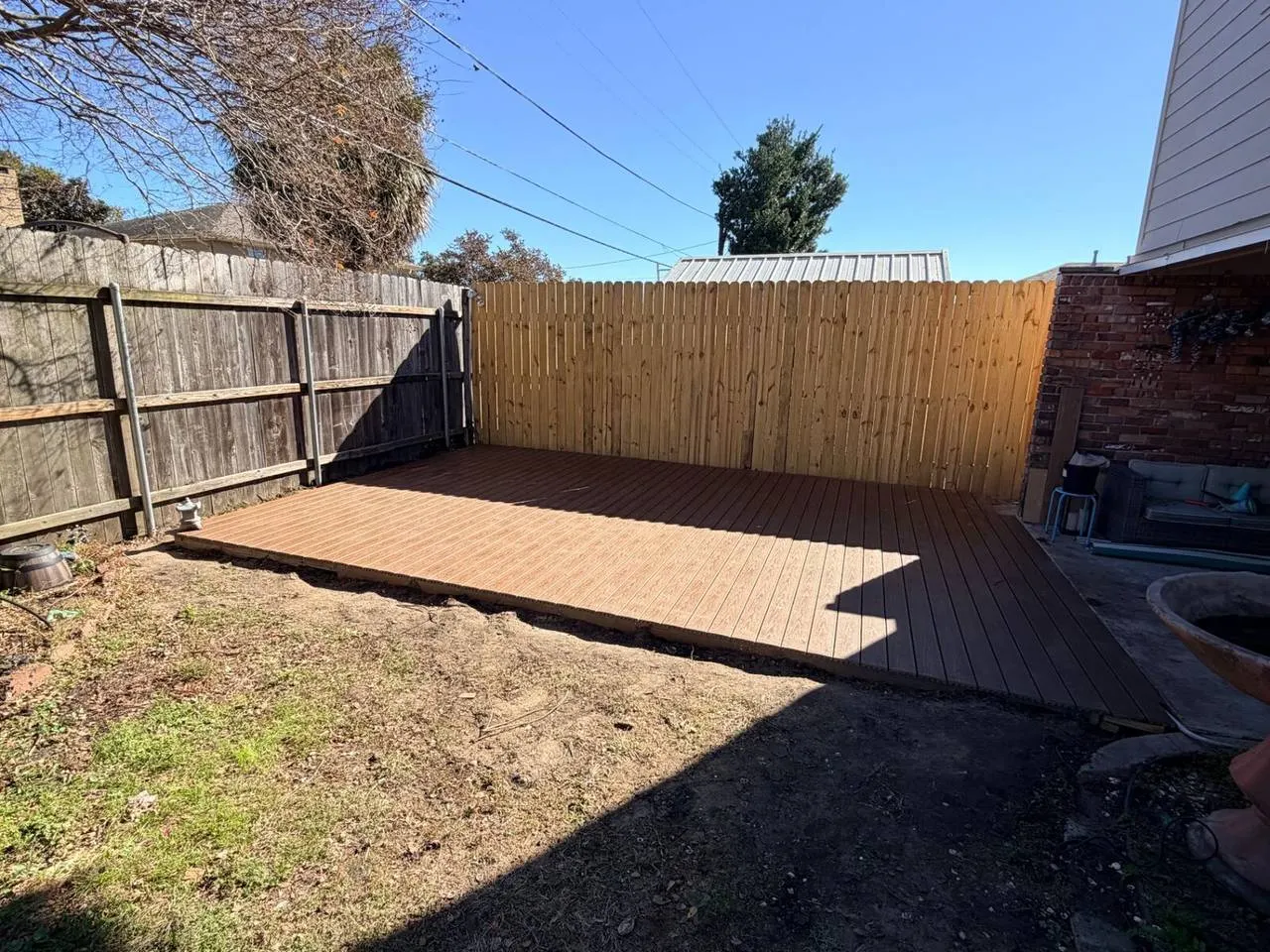 Finished composite deck installation in Metairie LA residential backyard