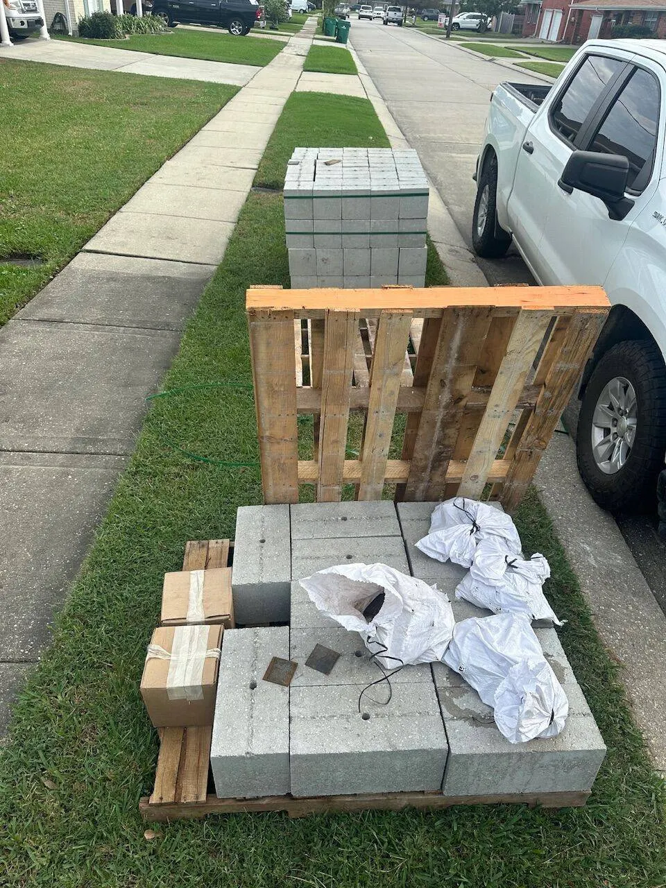 Concrete blocks and foundation repair materials staged at Metairie residential jobsite