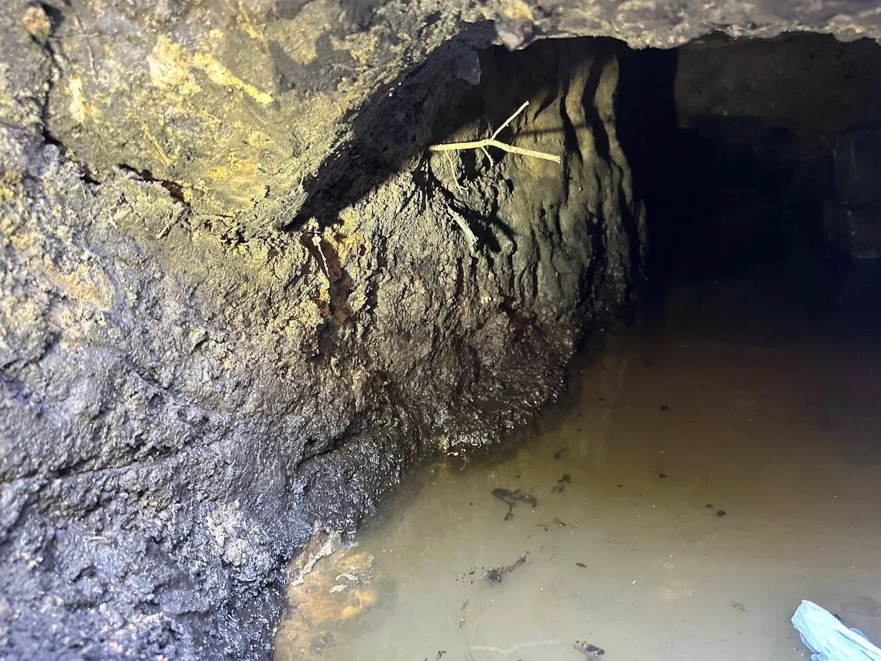 Crawlspace showing water damage requiring foundation and structural repair in Jefferson Parish