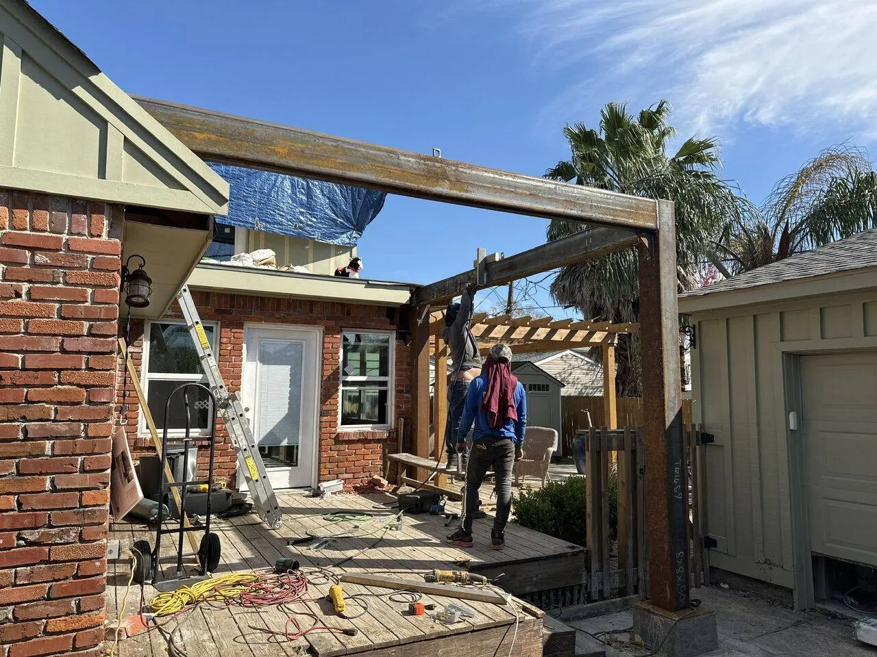 Cajun Home Services crew installing steel beam frame for second story home addition in Jefferson Parish