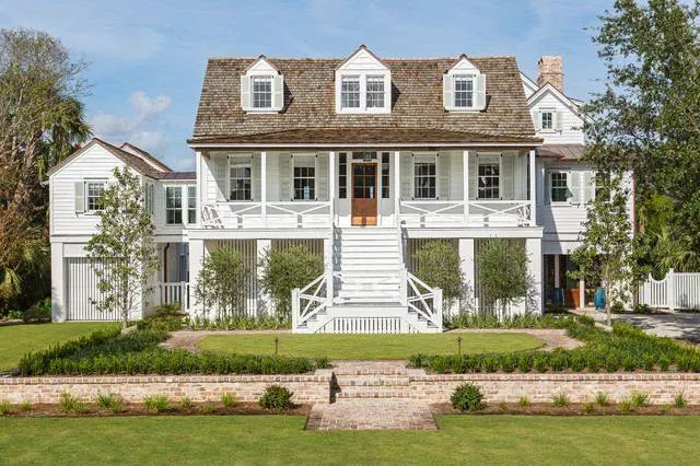 Custom coastal home exterior with siding and trim work in Kenner