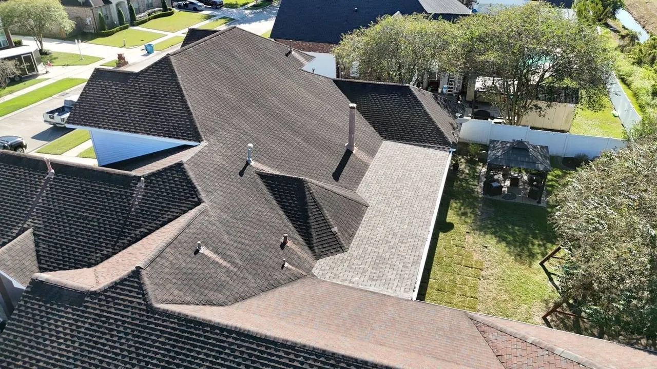 Aerial view of multi-tone designer shingle roof on luxury home in Destrehan, Louisiana