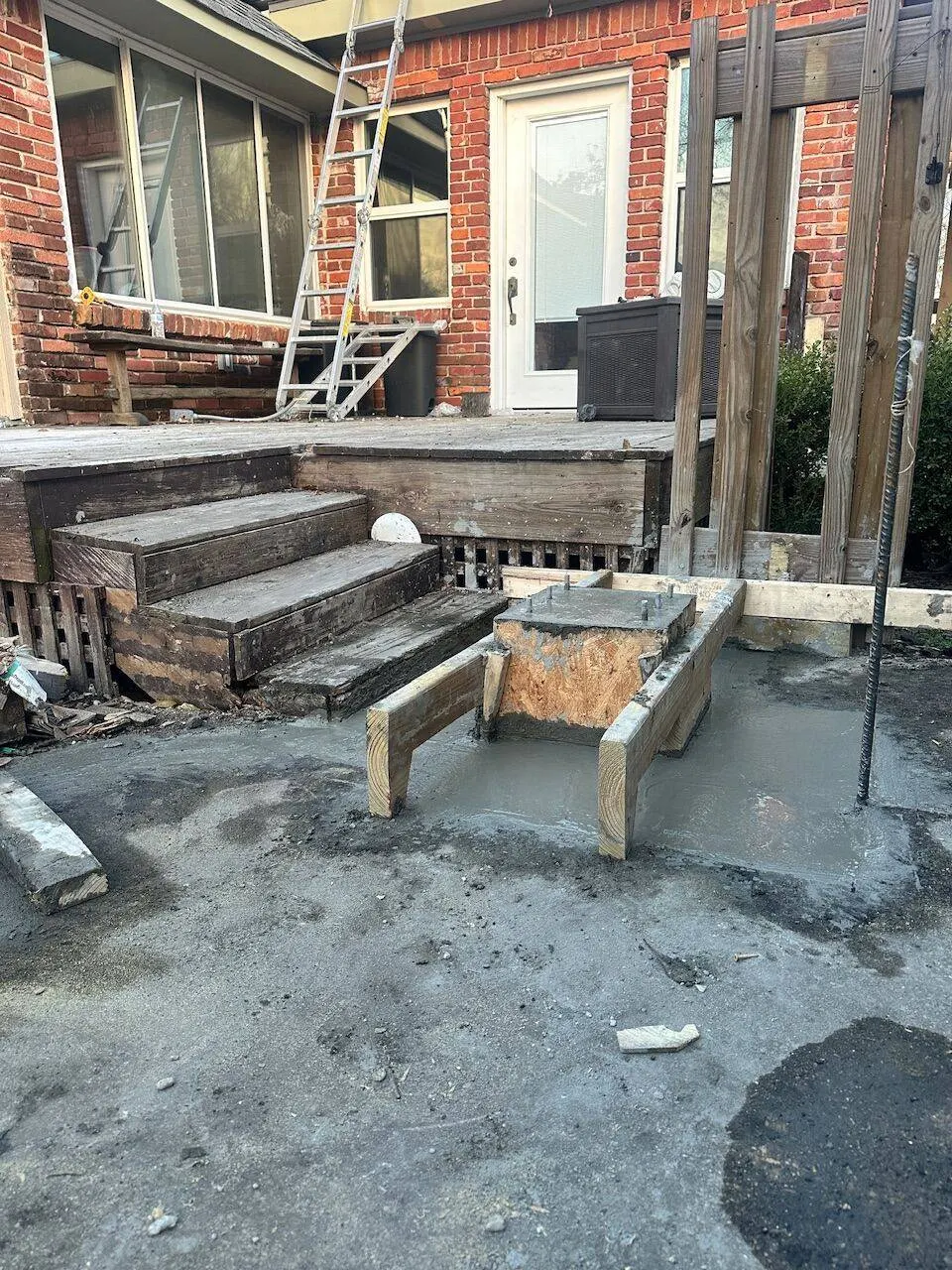Foundation concrete pour with forms and pier construction at residential site in Metairie