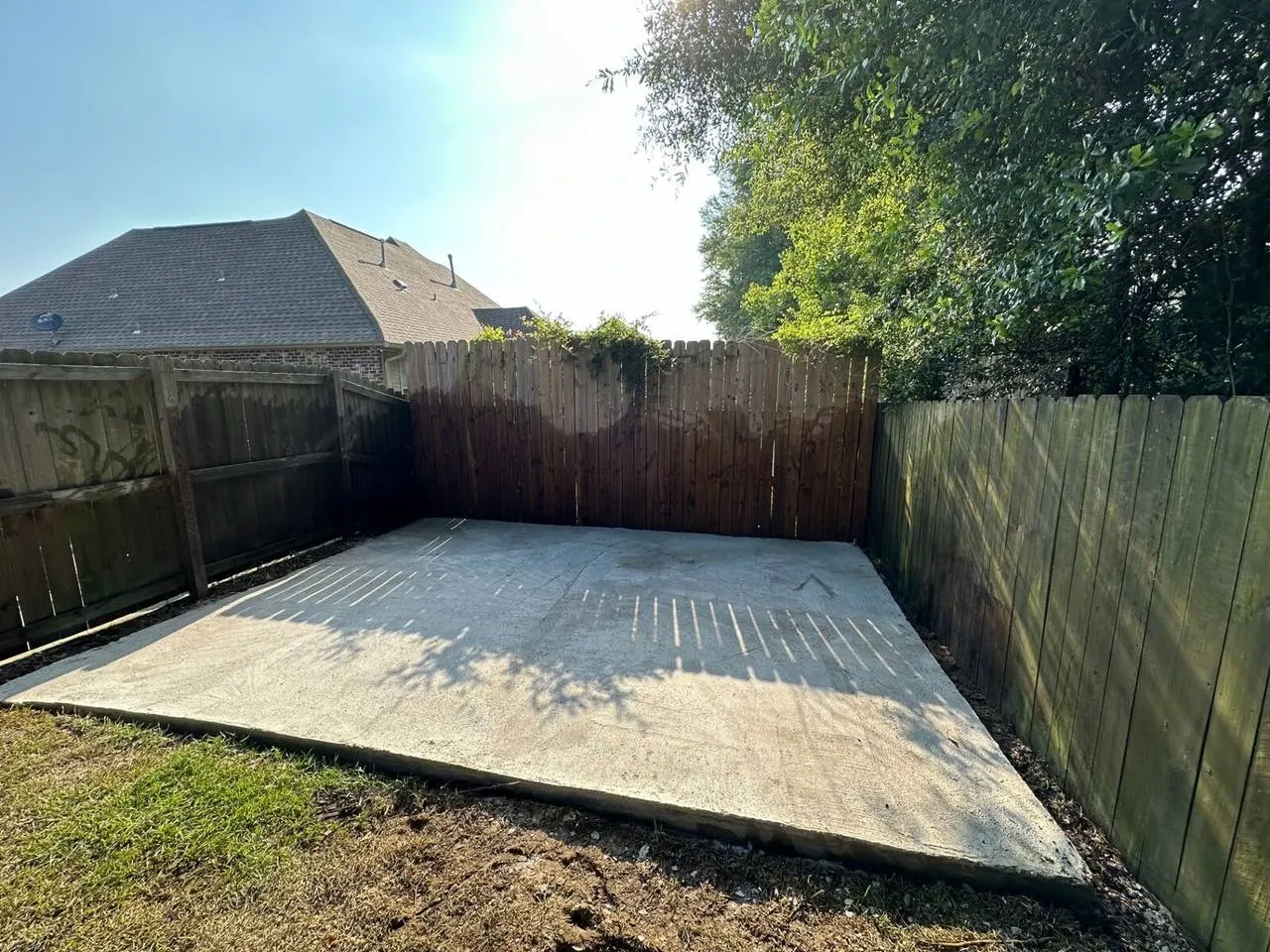 Foundation contractor Hammond Louisiana freshly poured concrete slab in residential backyard