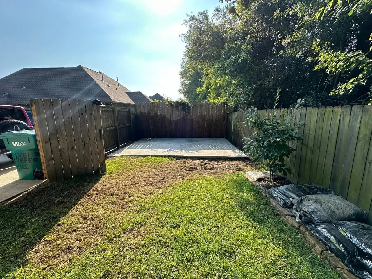 Backyard concrete slab pour for foundation extension in Hammond Louisiana residential property