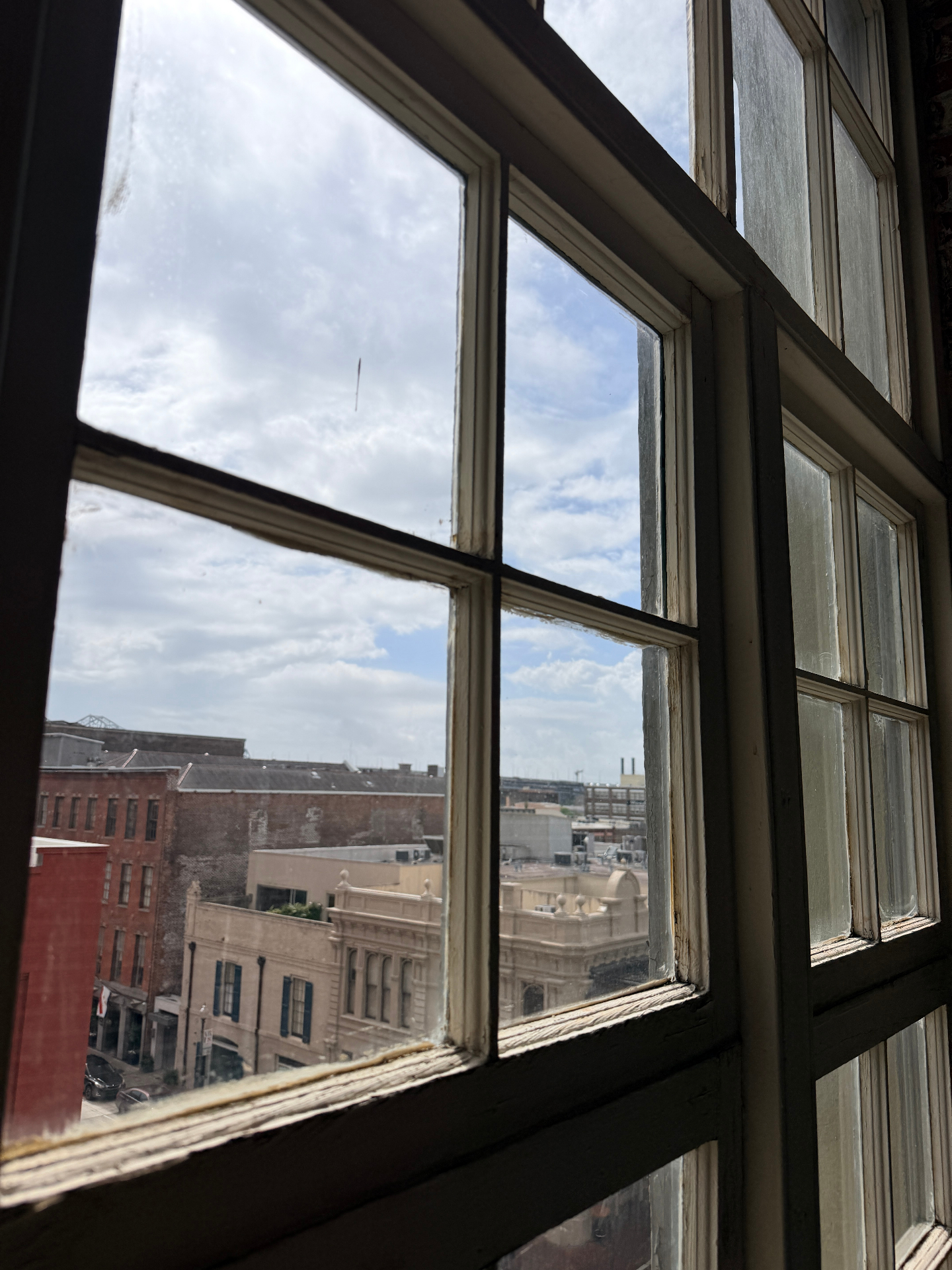 Upper sash condition before historic window repair in downtown New Orleans