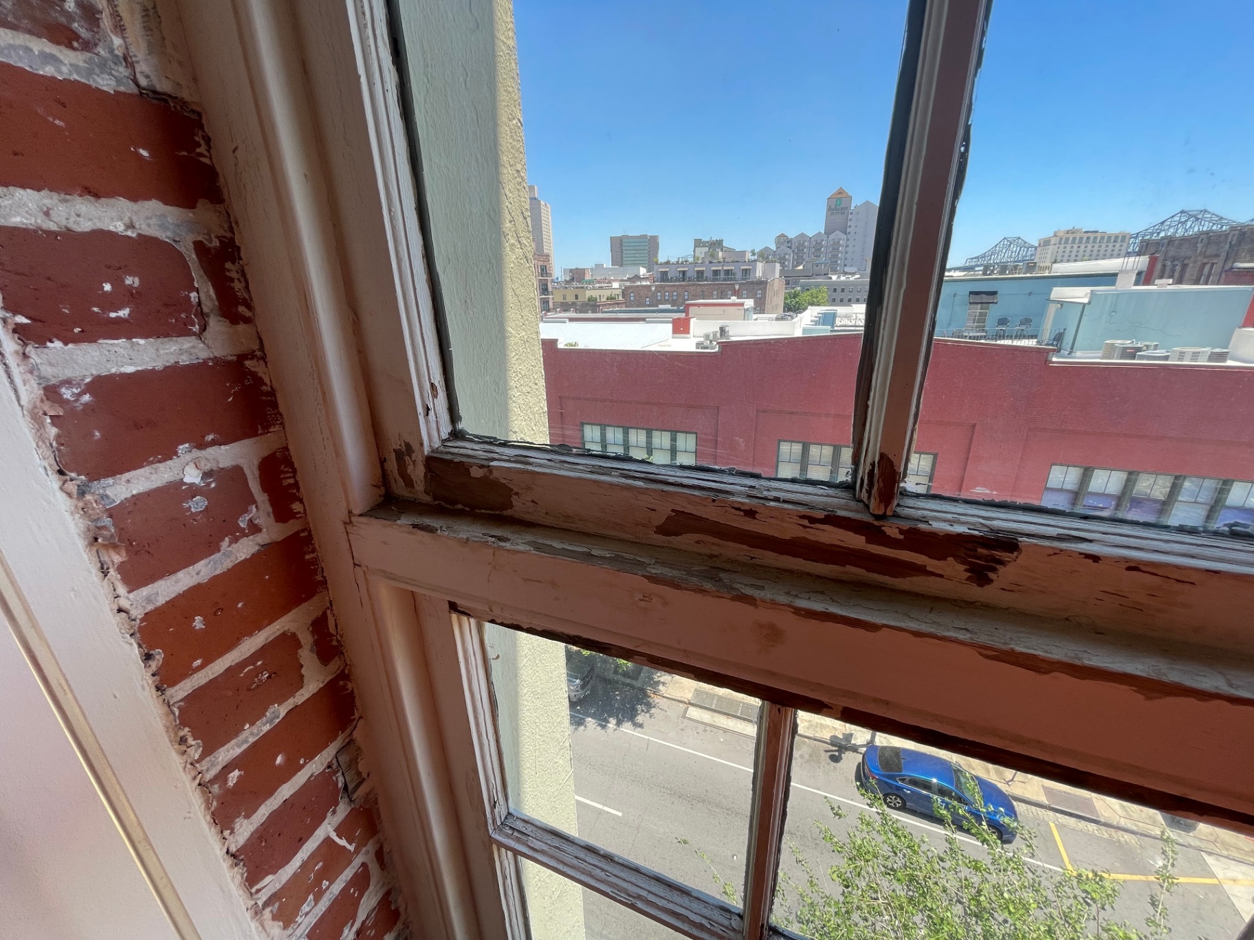 Historic window prep sequence prior to patching and priming in New Orleans CBD
