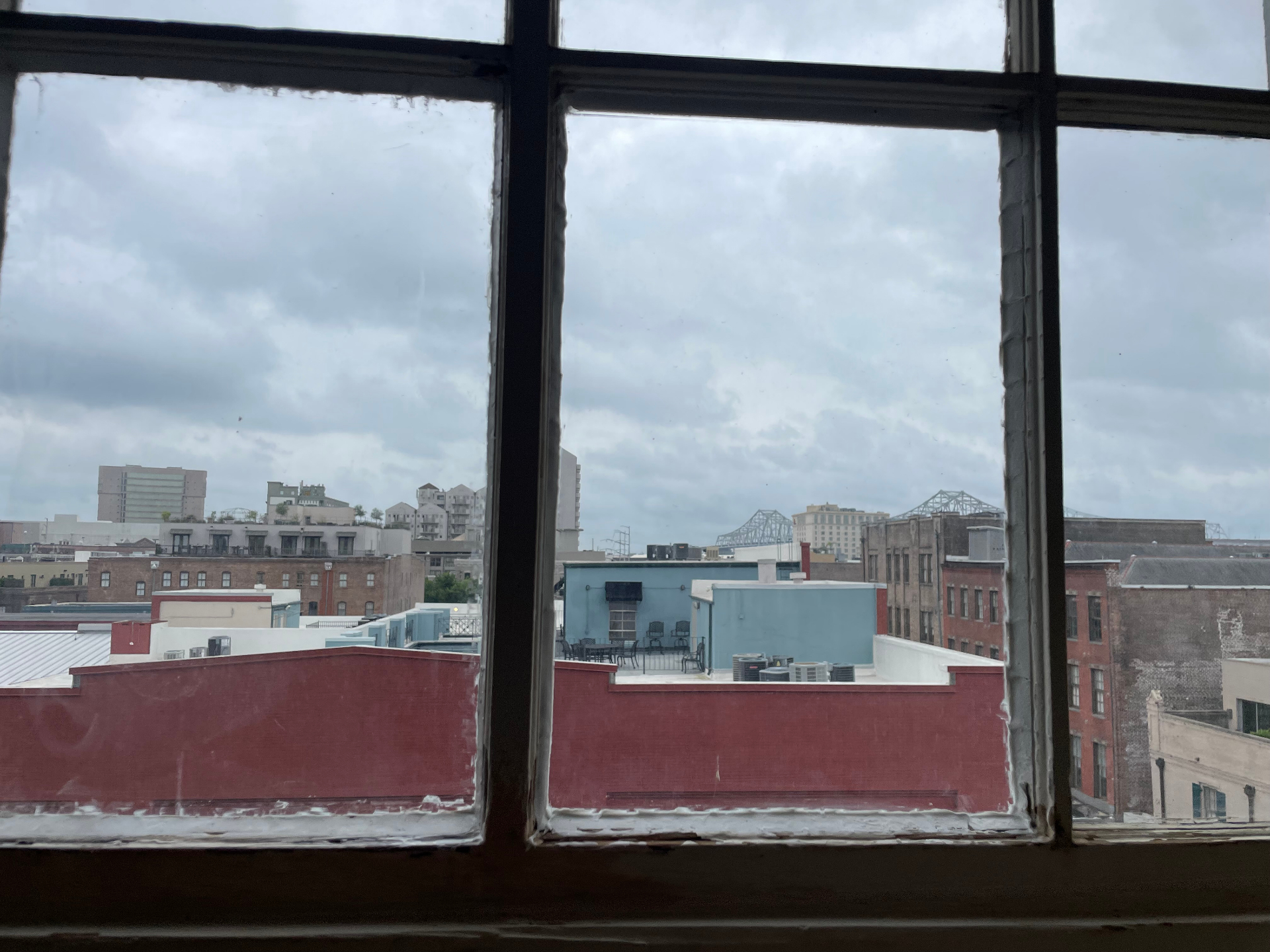 Historic window frame during patching and glazing restoration sequence