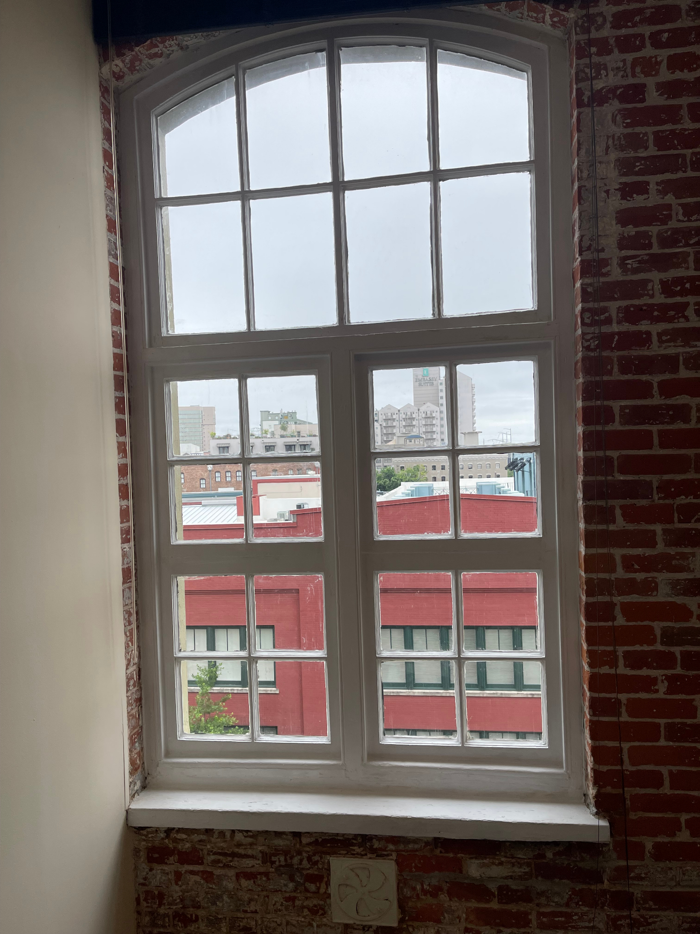 Historic divided-pane sash after glazing and paint restoration work