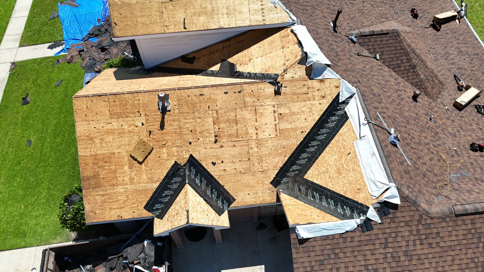 Aerial view of CertainTeed ice and water shield self-adhered membrane installed in the valleys and hips of a Destrehan Louisiana shingle roof replacement before underlayment and shingles