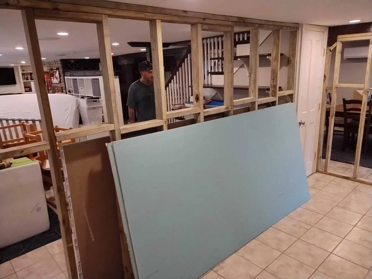 Interior wall framing and drywall staging for a bedroom addition in New Orleans Louisiana