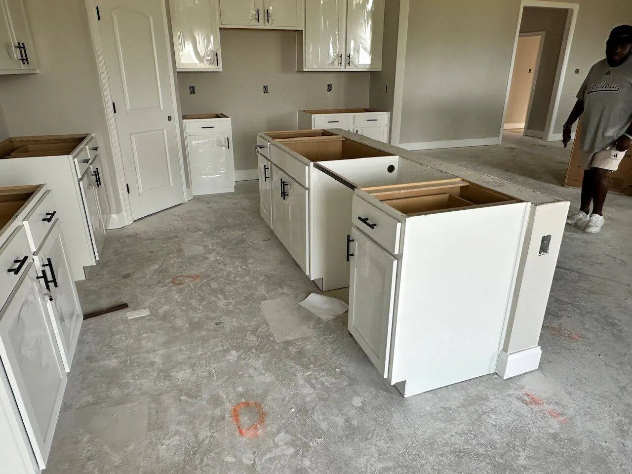 New construction kitchen cabinet and island installation by Cajun Home Services in Kenner LA