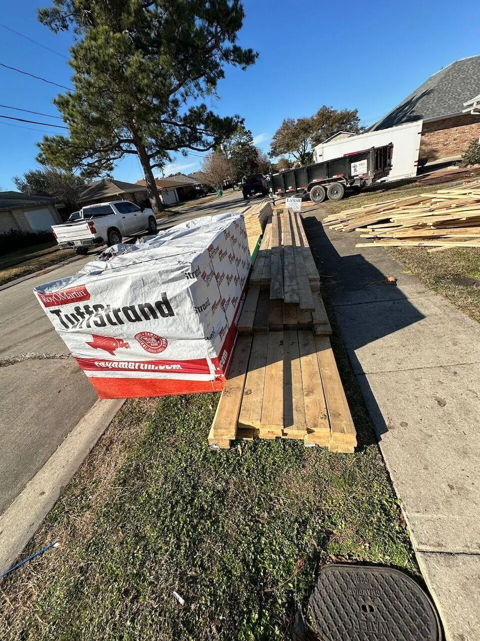 Lumber and materials delivered to roofing jobsite in Louisiana by licensed contractor