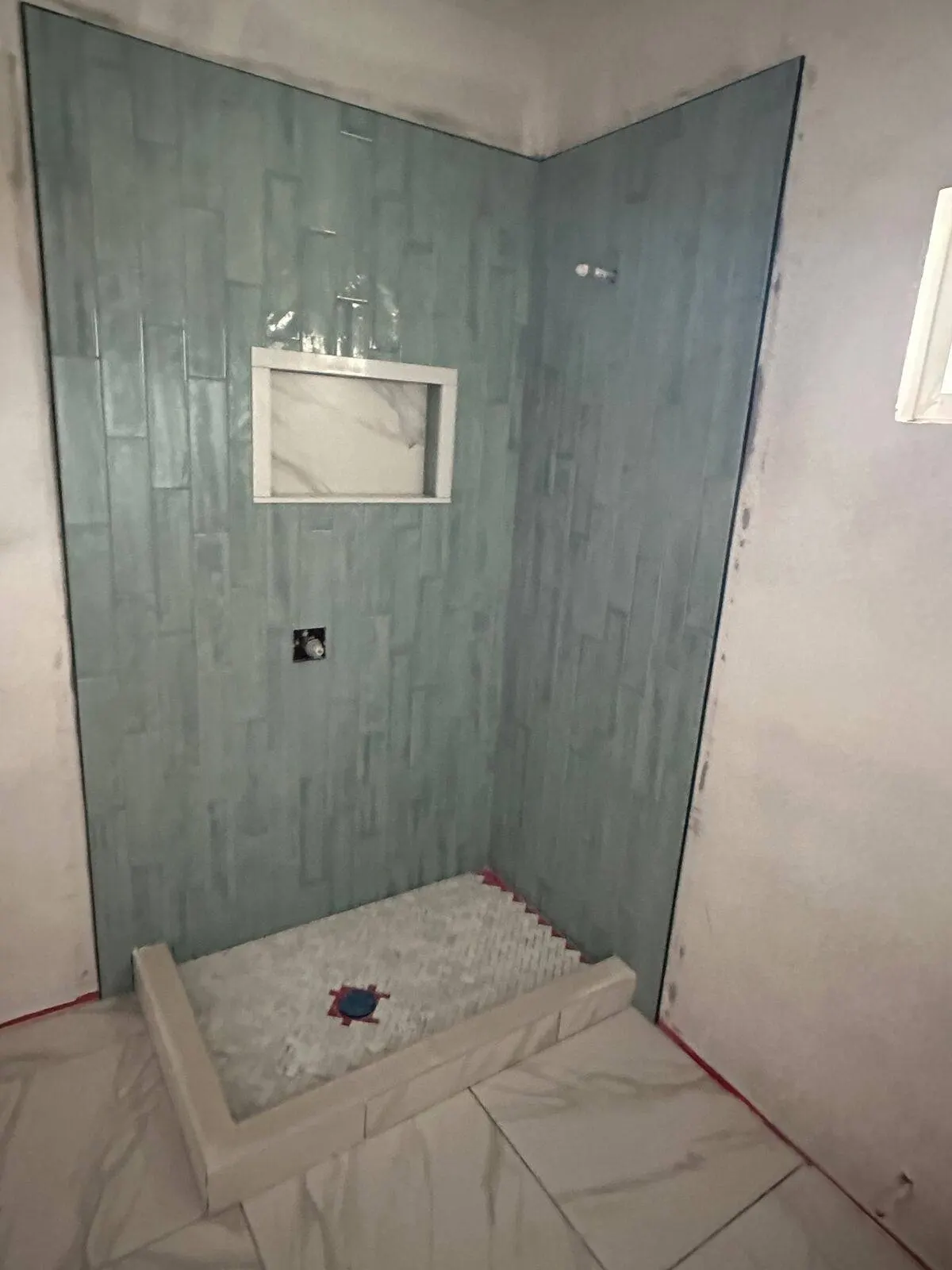 Custom tile shower installation in progress in Metairie bathroom remodel