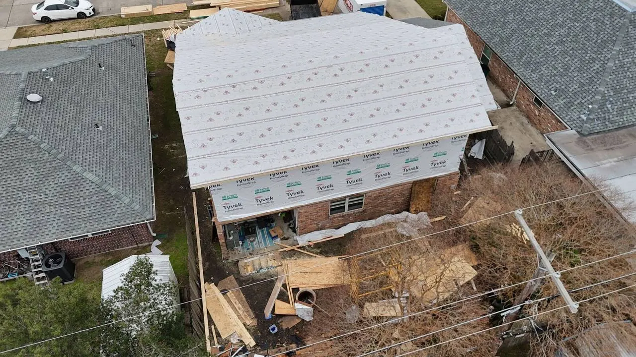 Home addition framing and roof extension project in Metairie neighborhood